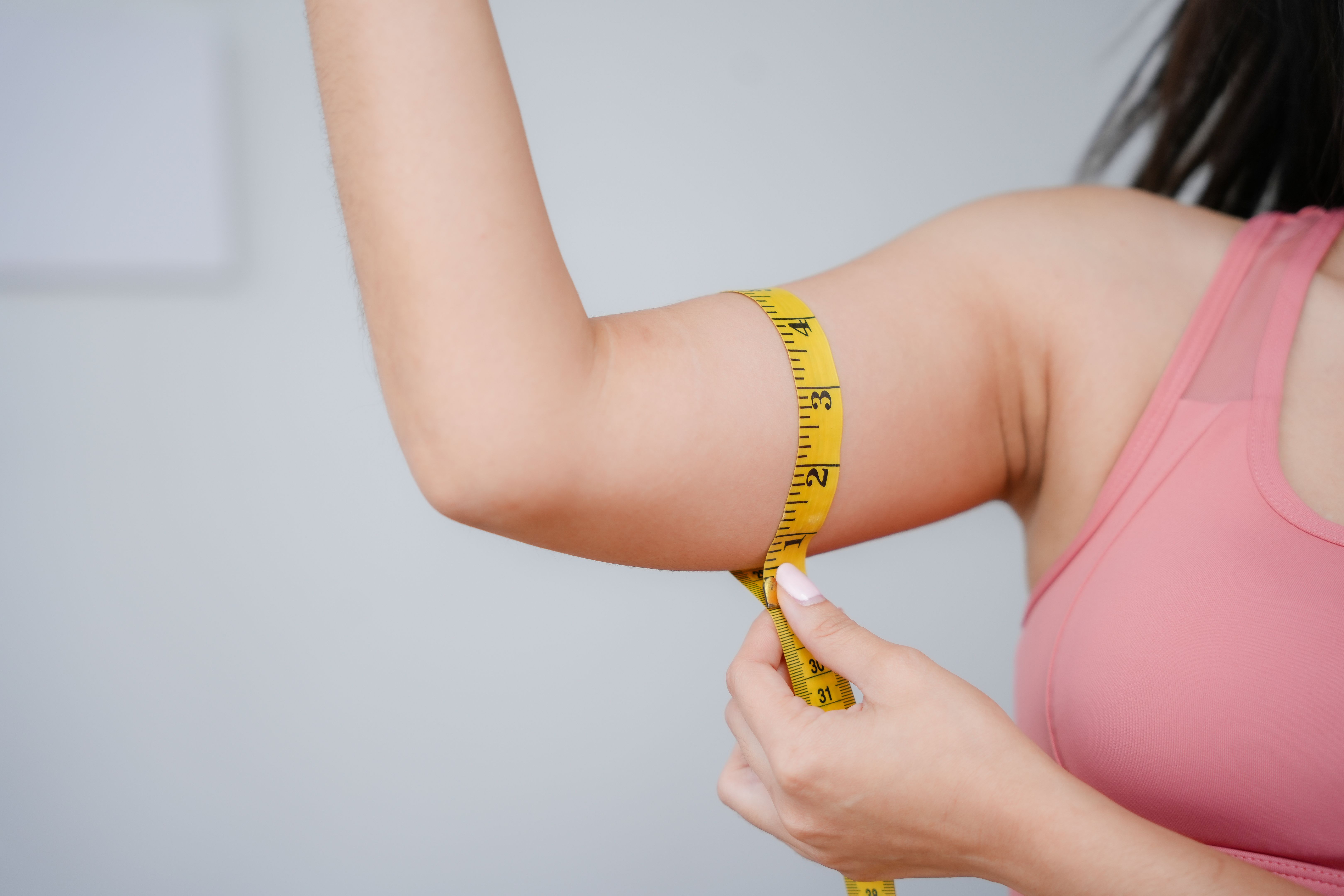 measuring tape on arm