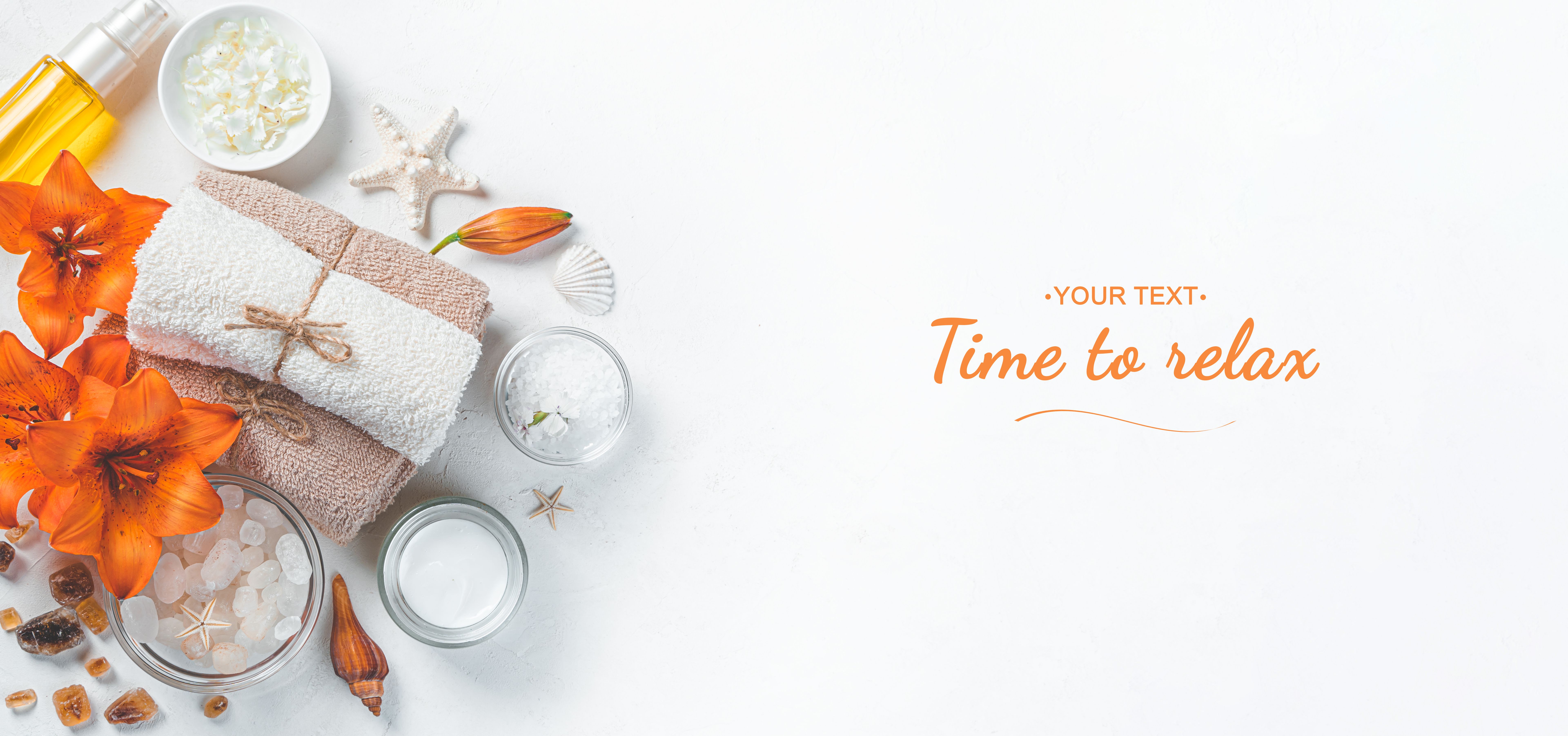 Spa composition with towel, body care cosmetics and fresh flowers. Spa composition with towel, body care cosmetics and fresh flowers.