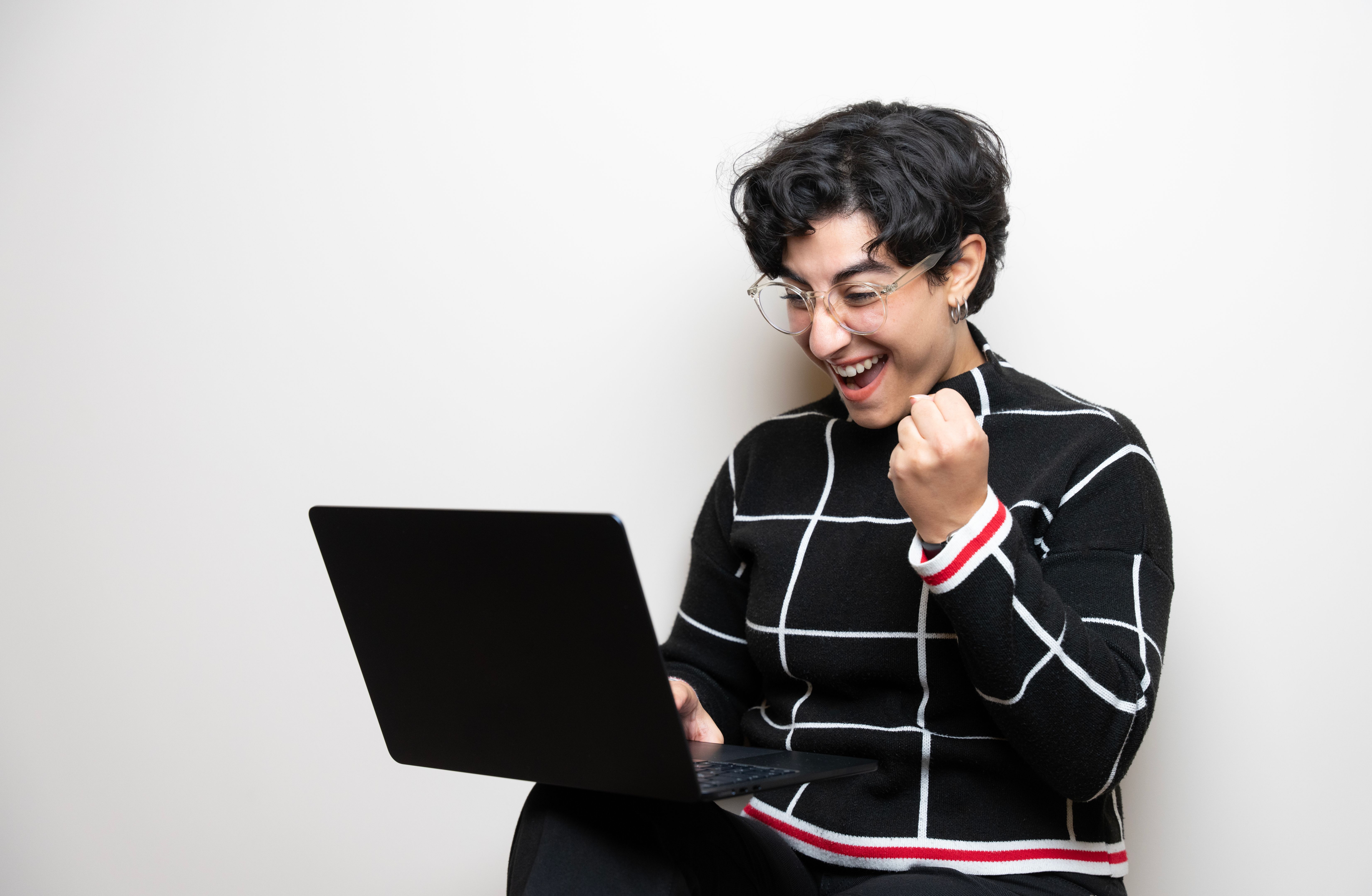 happy person with laptop