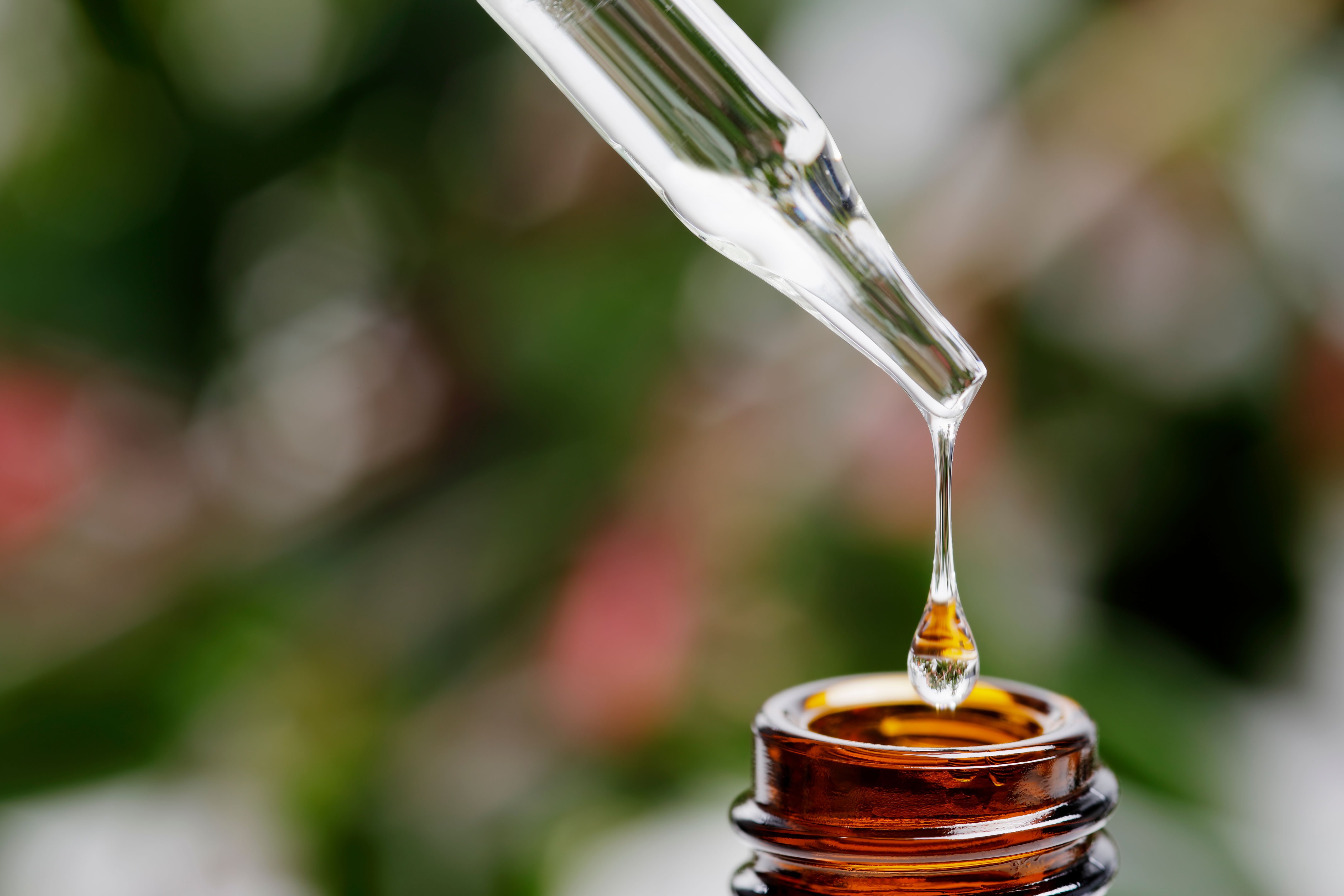 Brown herbal extraction bottle with a dropper