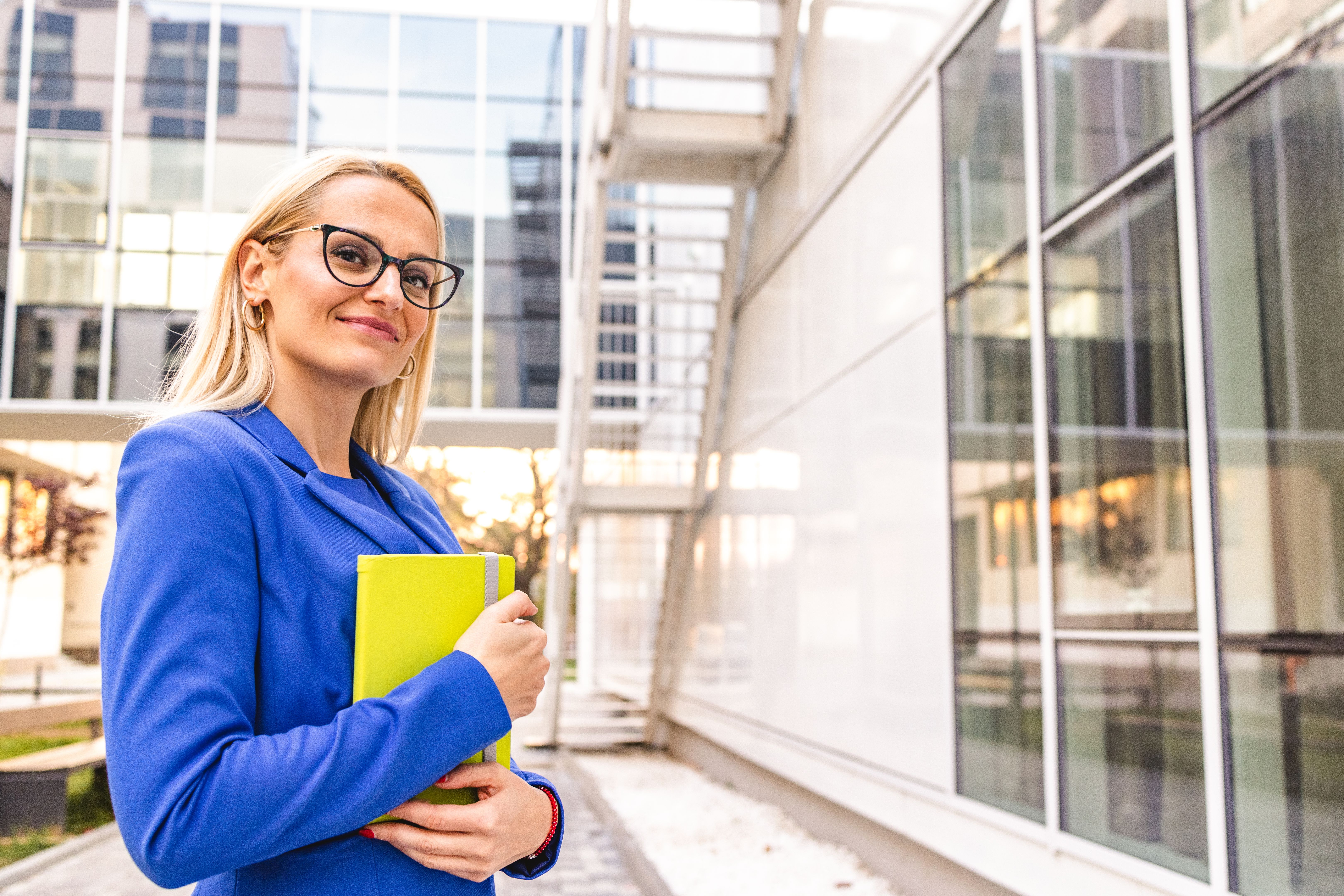 Portrait of confident Caucasian businesswoman in blue suit Portrait of confident Caucasian businesswoman in blue suit
