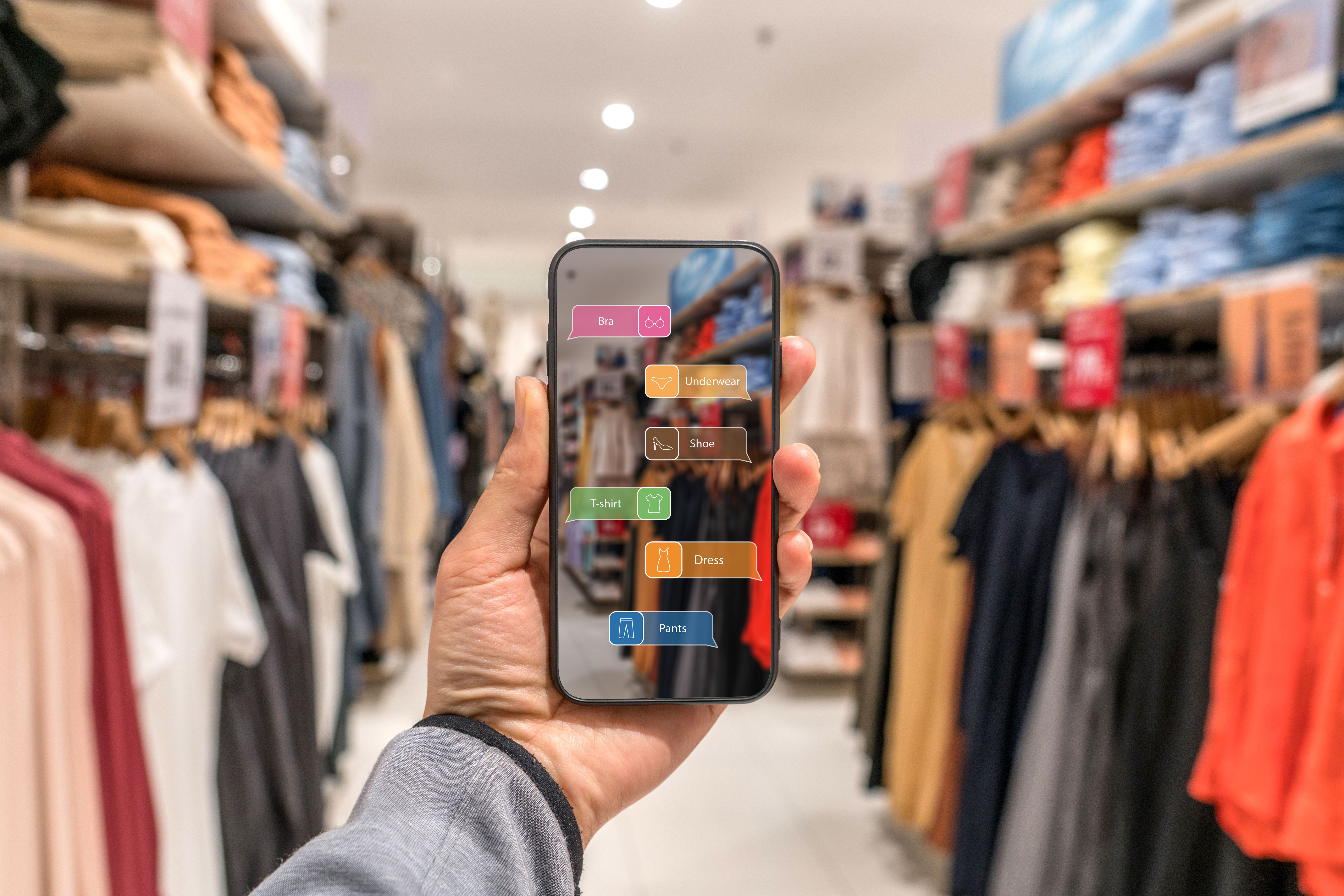 Augmented reality marketing . Hand holding smart phone use AR application to check information Augmented reality marketing . Hand holding smart phone use AR application to check information