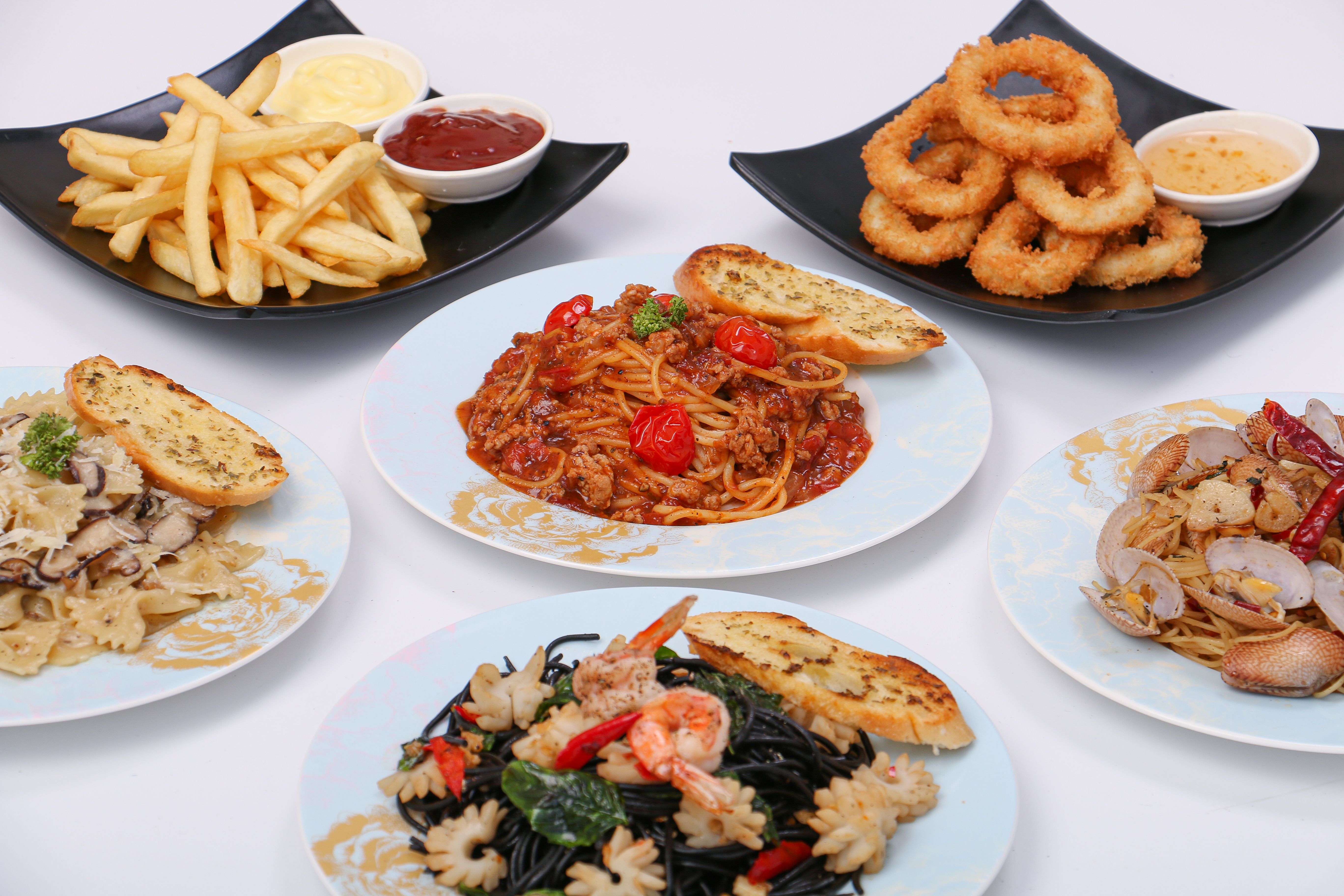 set of various plates of food, pasta dishes, onion ring, french fried, isolated on white background, top view. set of various plates of food, pasta dishes, onion ring, french fried, isolated on white background, top view.