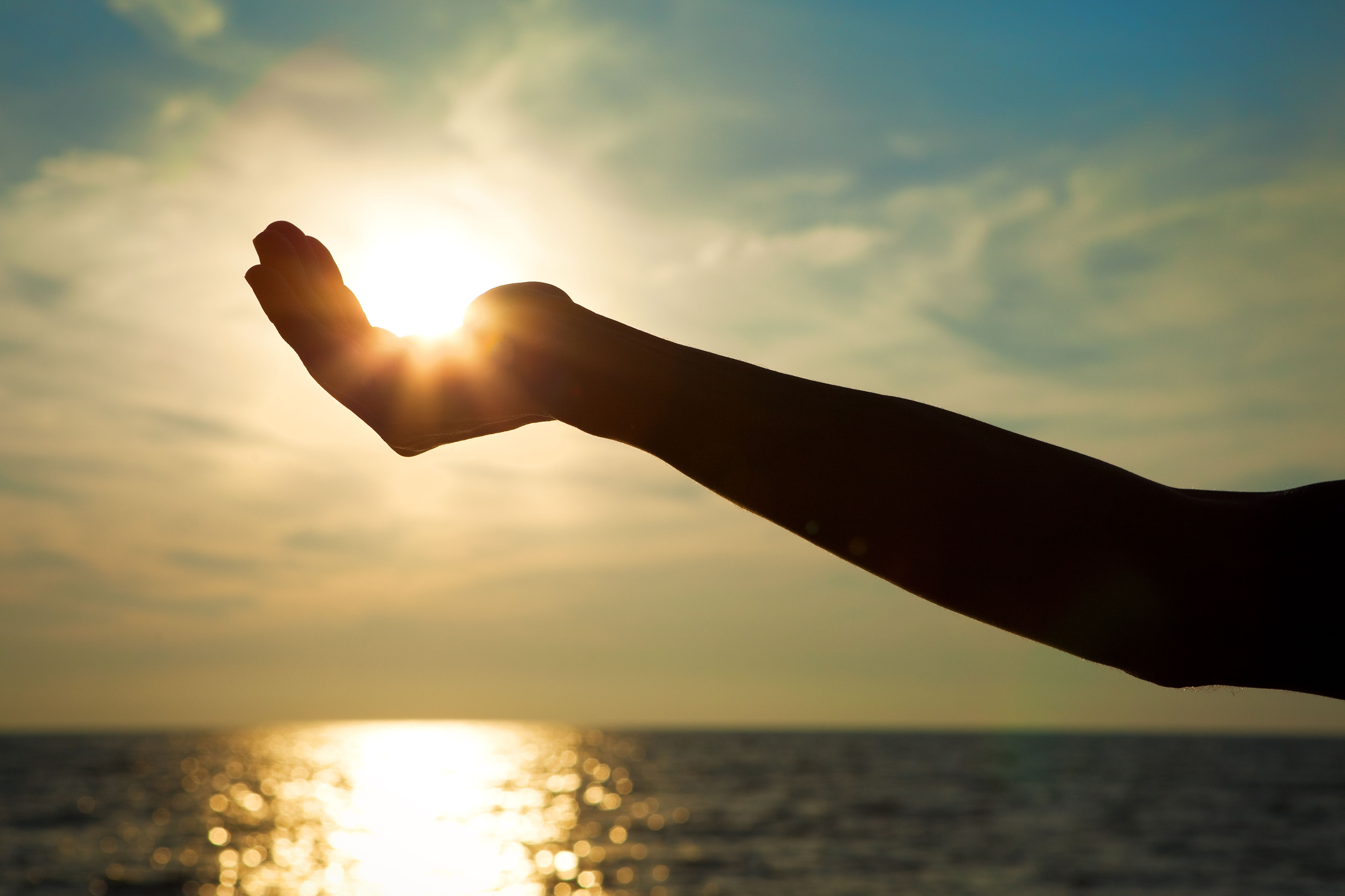 Hand Capturing The Sun