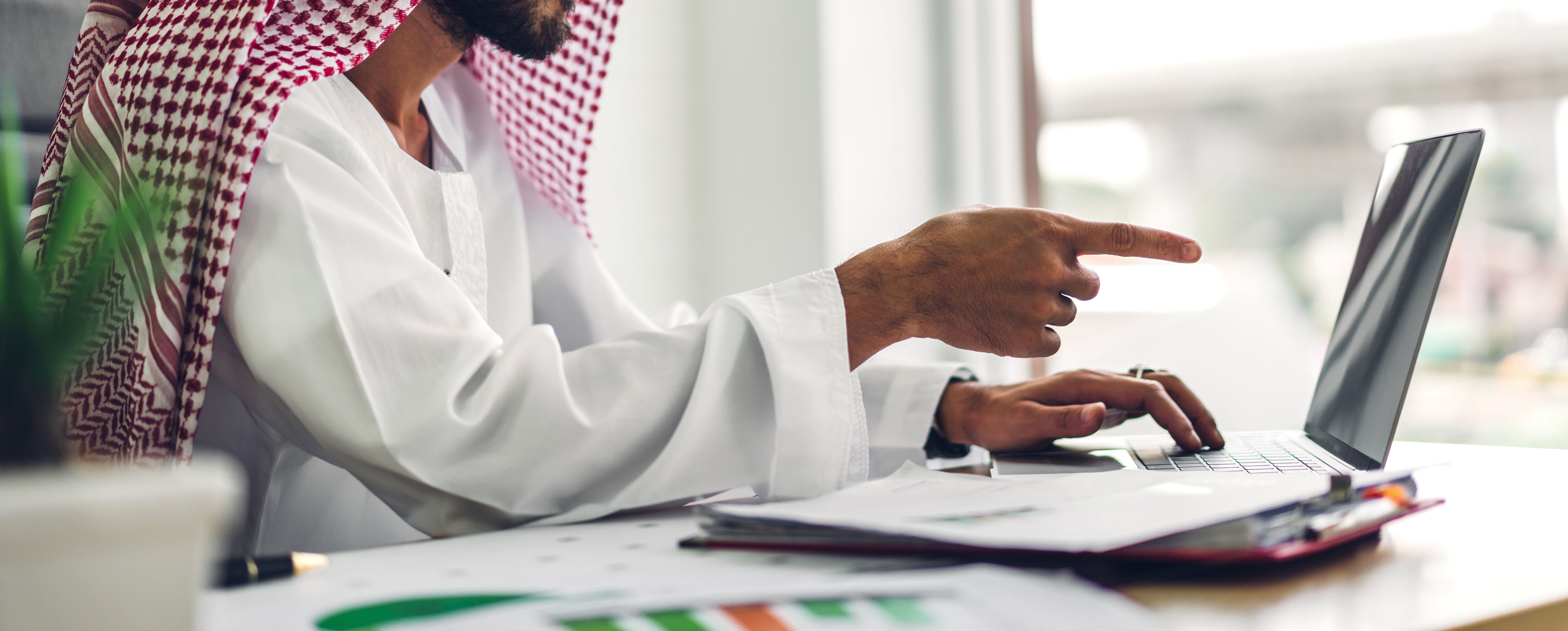 Arabic businessman working with laptop computer.creative arab business people planning at modern work loft Arabic businessman working with laptop computer.creative arab business people planning at modern work loft