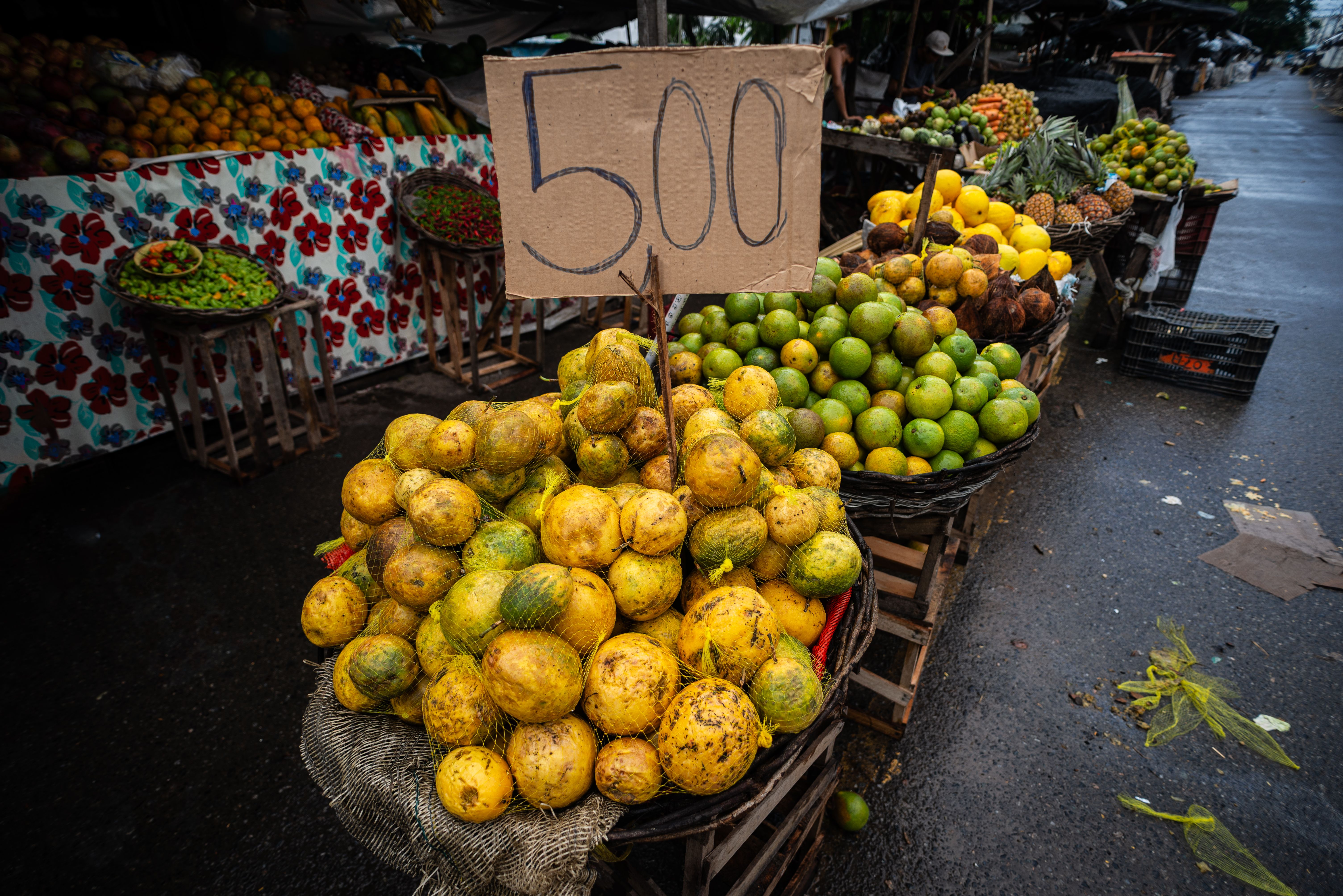 Passion fruit, orange and other fruits for sale at a street market. Rich source of healthy food. Passion fruit, orange and other fruits for sale at a street market. Rich source of healthy food.