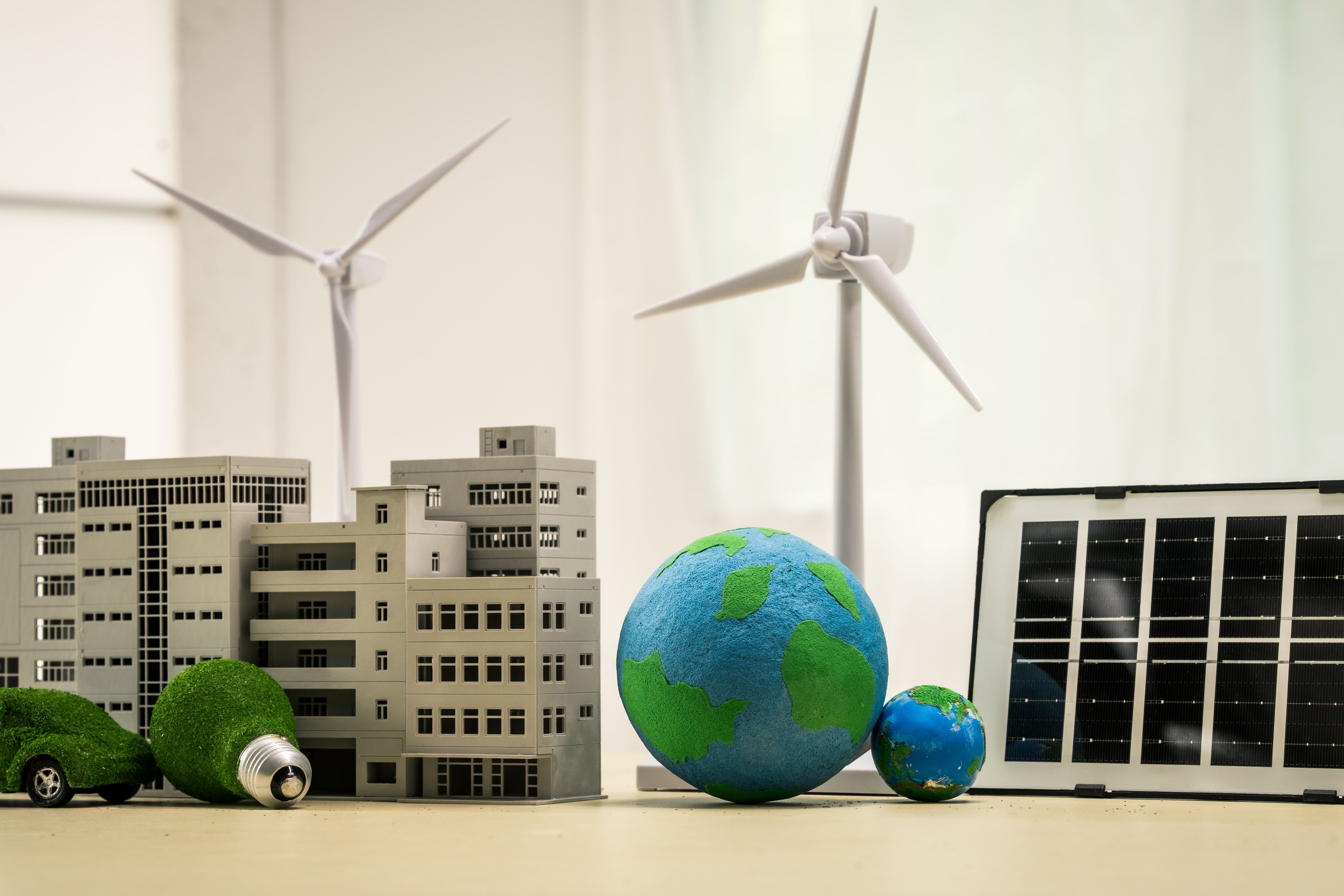 A businesswoman working at a desk in sustainable urban development, promoting eco-friendly futures with green condos and buildings, fostering a clean environment-friendly future. A businesswoman working at a desk in sustainable urban development, promoting eco-friendly futures with green condos and buildings, fostering a clean environment-friendly future.