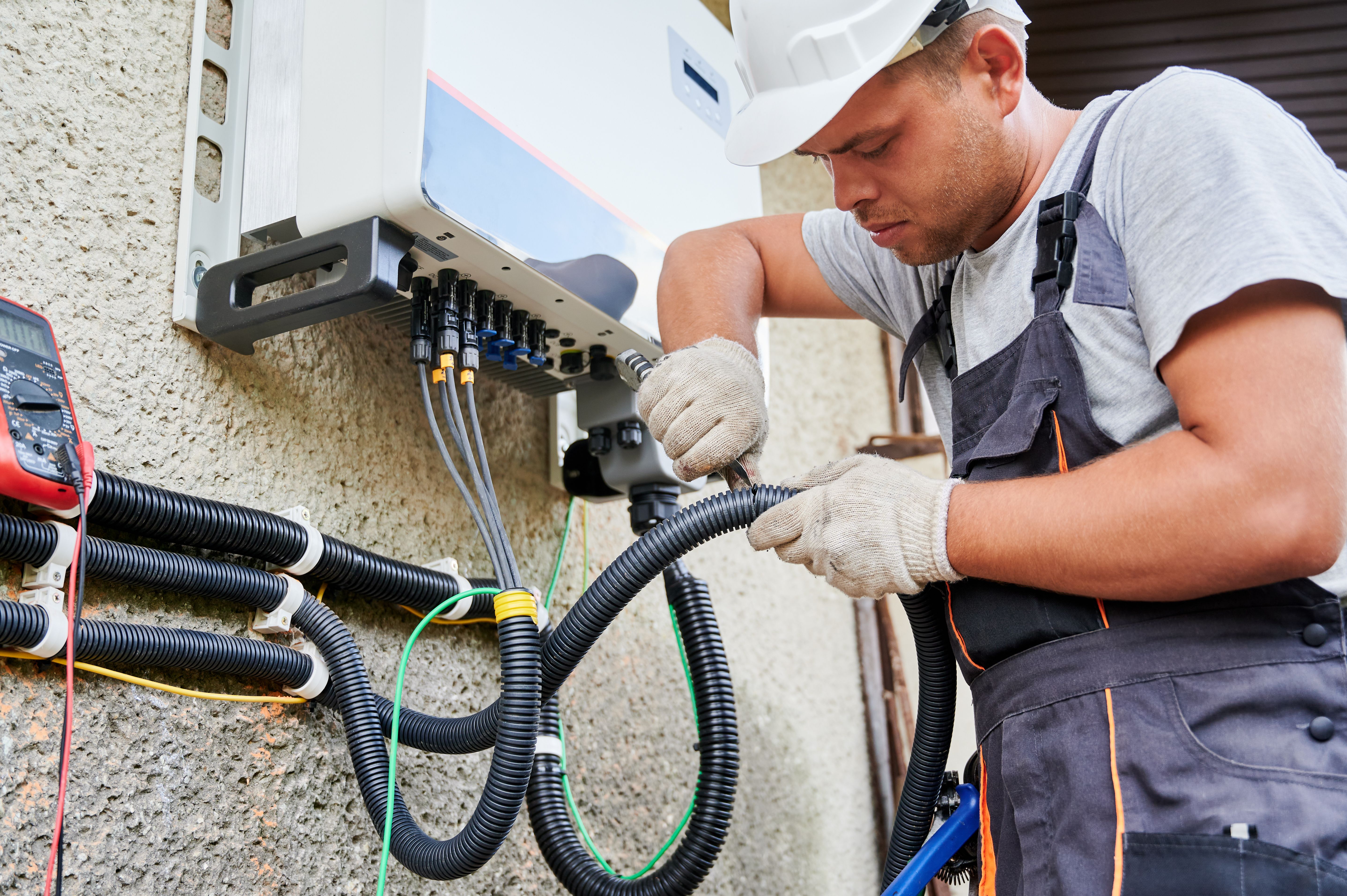 electrician installing battery