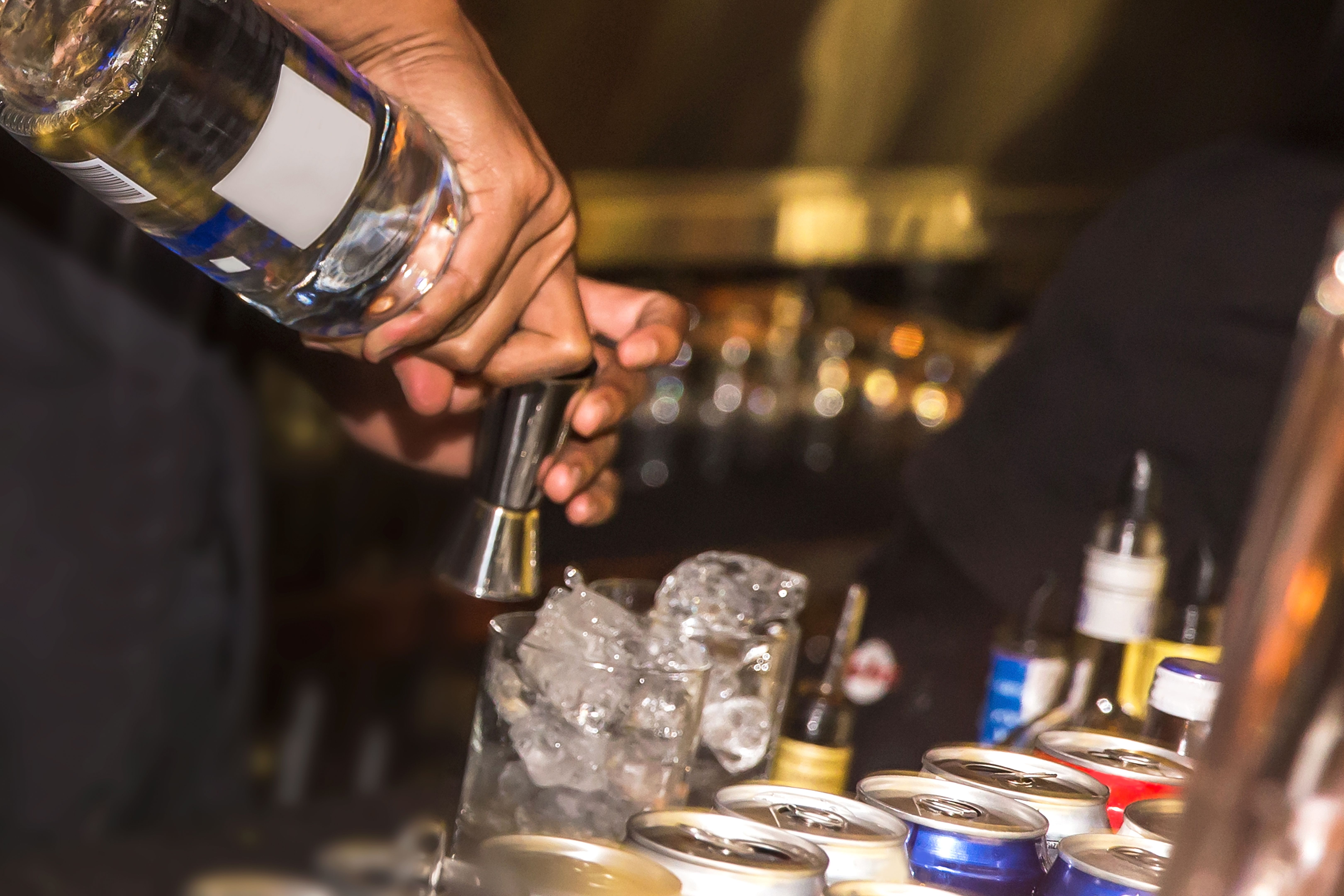 Males bartender making alcohol drinks Males bartender making alcohol drinks