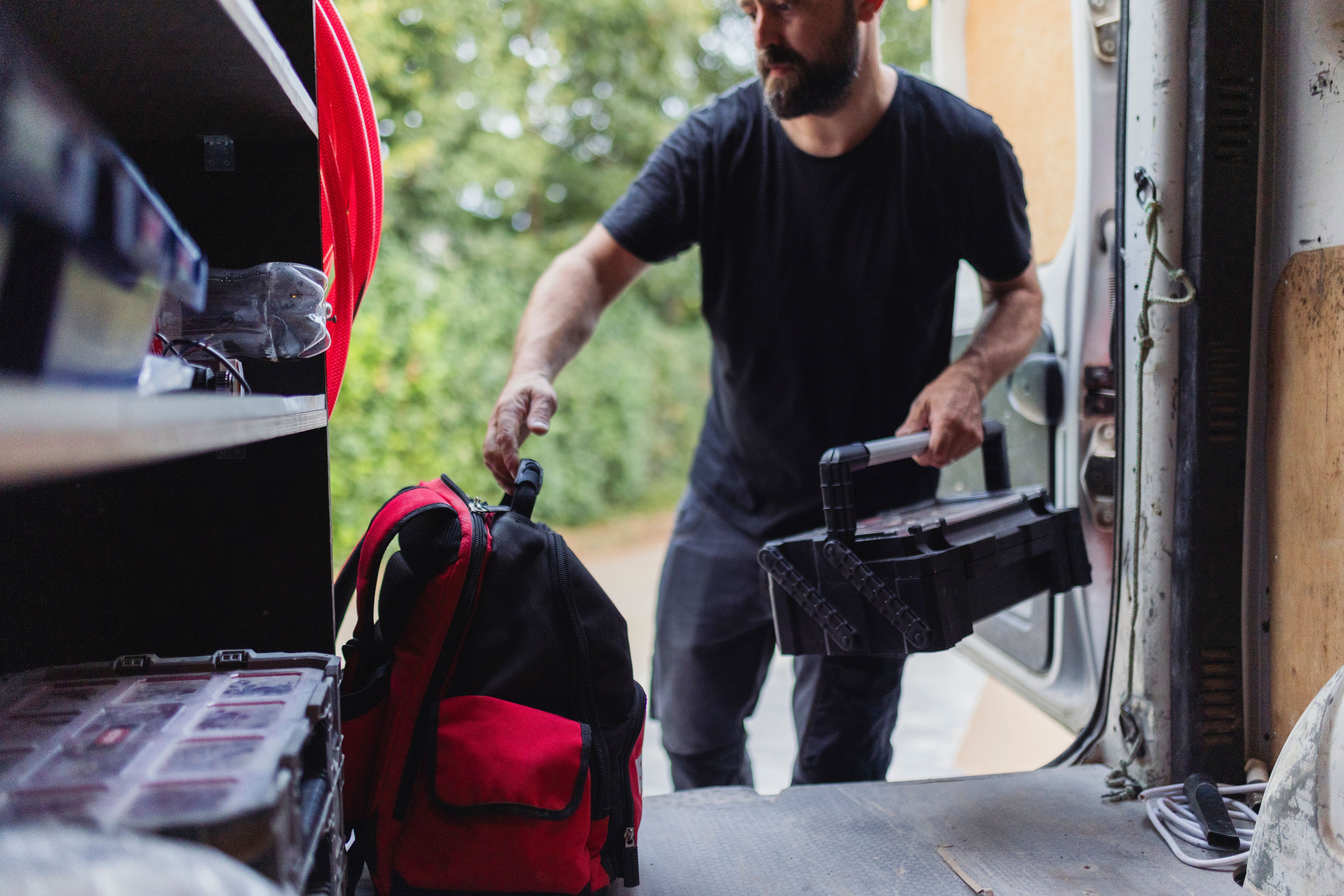 Electrician leaves the work tool in the trunk of the car after installing the heating pump