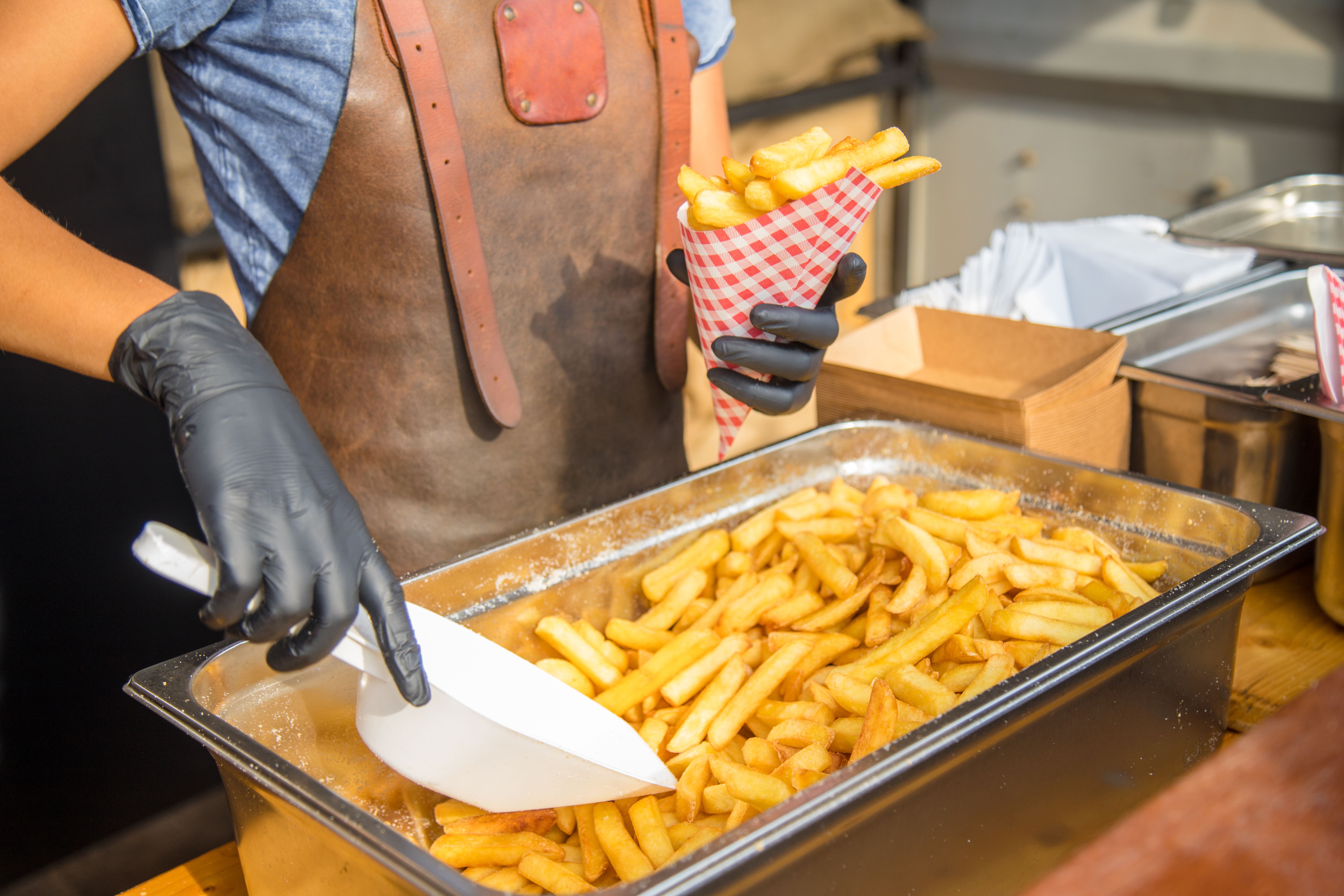 Savoring Dutch Delights: Chip Stand at a Festival serving french fries