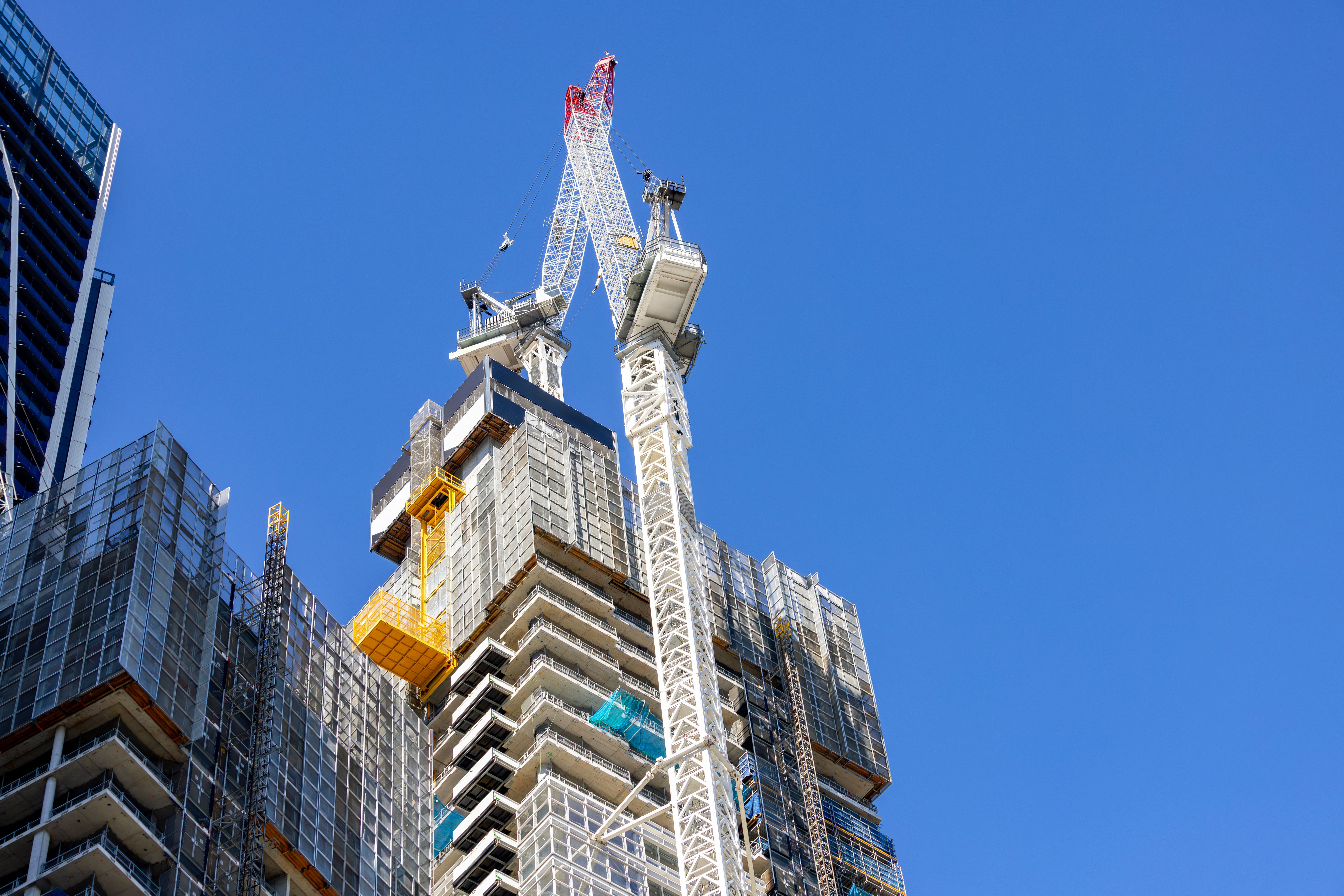Construction of skyscrapers in the city, background with copy space Construction of skyscrapers in the city, background with copy space