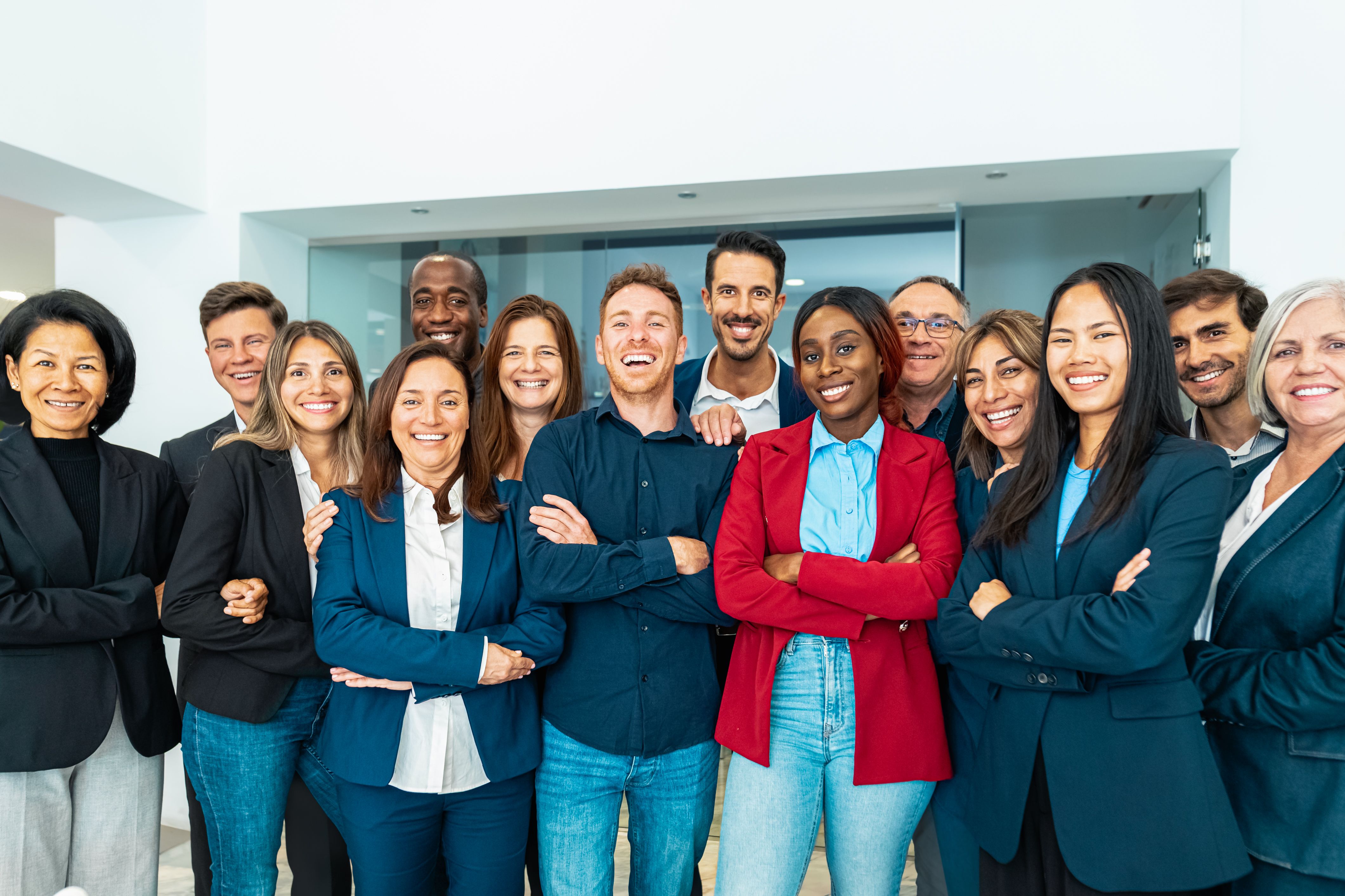 Group of multigenerational business team standing in front of camera during meeting work - Businesspeople with diverse age and ethnicity concept Group of multigenerational business team standing in front of camera during meeting work - Businesspeople with diverse age and ethnicity concept
