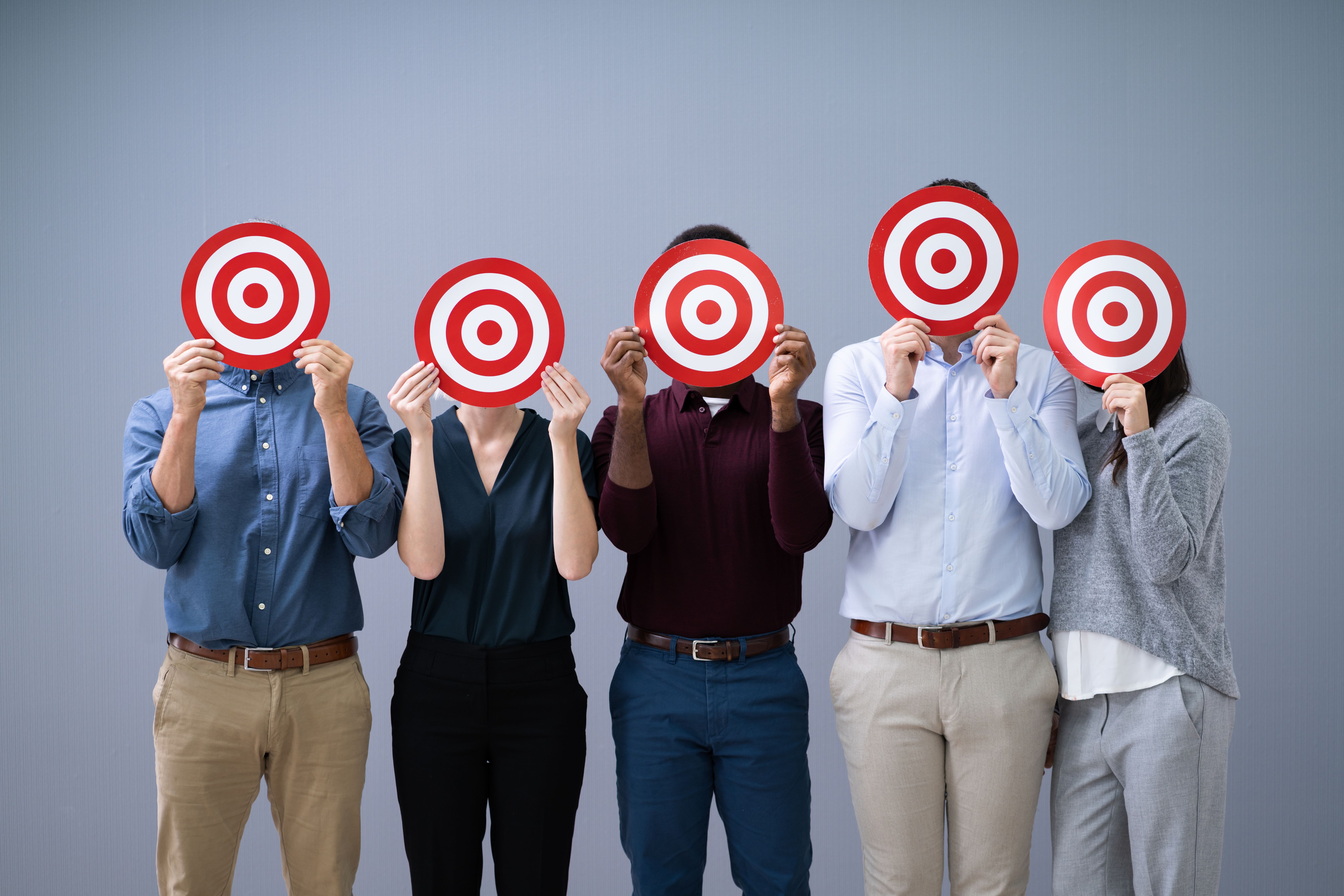 Businesspeople Holding Dartboard Businesspeople Holding Dartboard