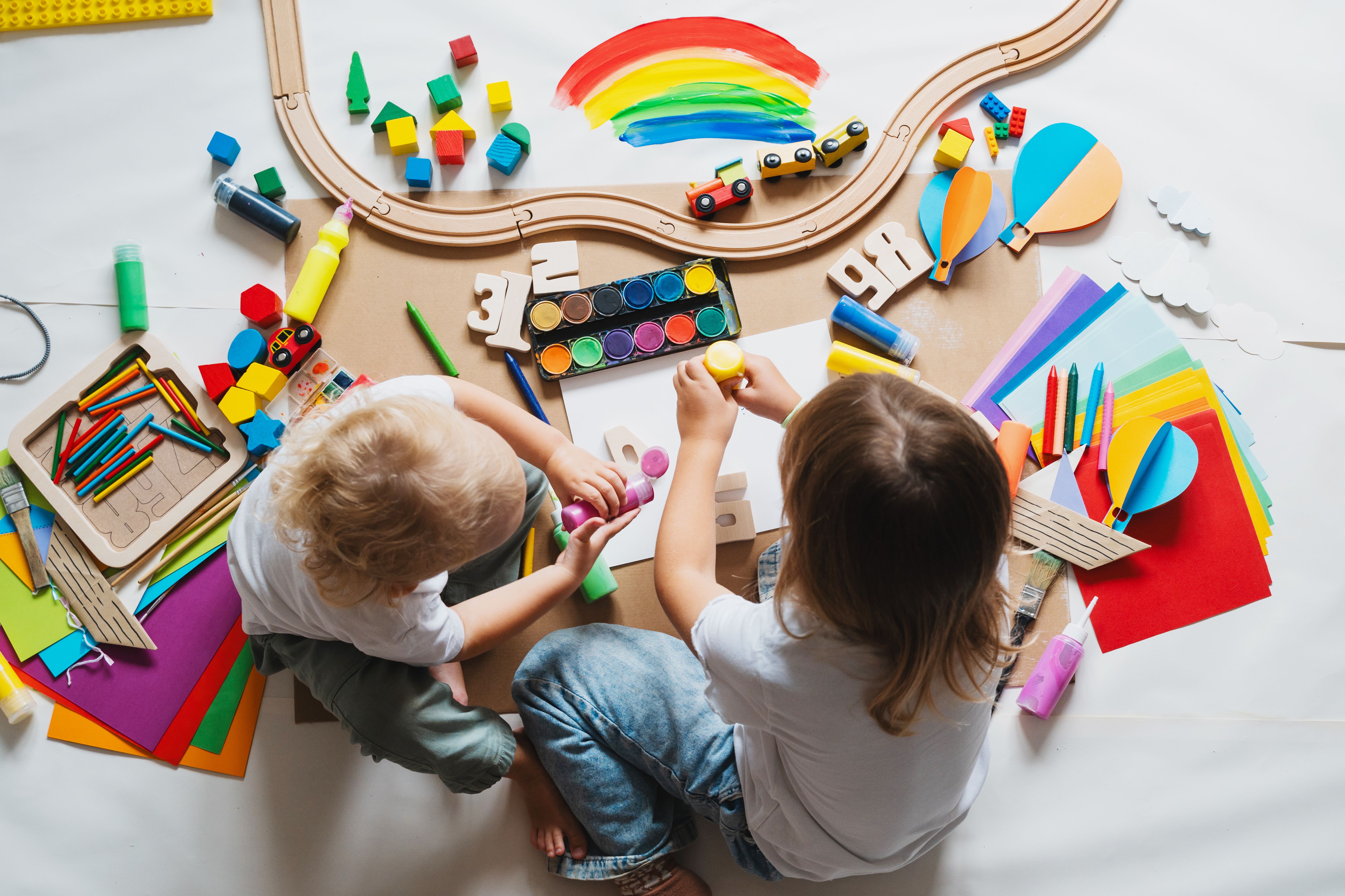 Children drawing and making crafts in kindergarten or daycare. Children drawing and making crafts in kindergarten or daycare.