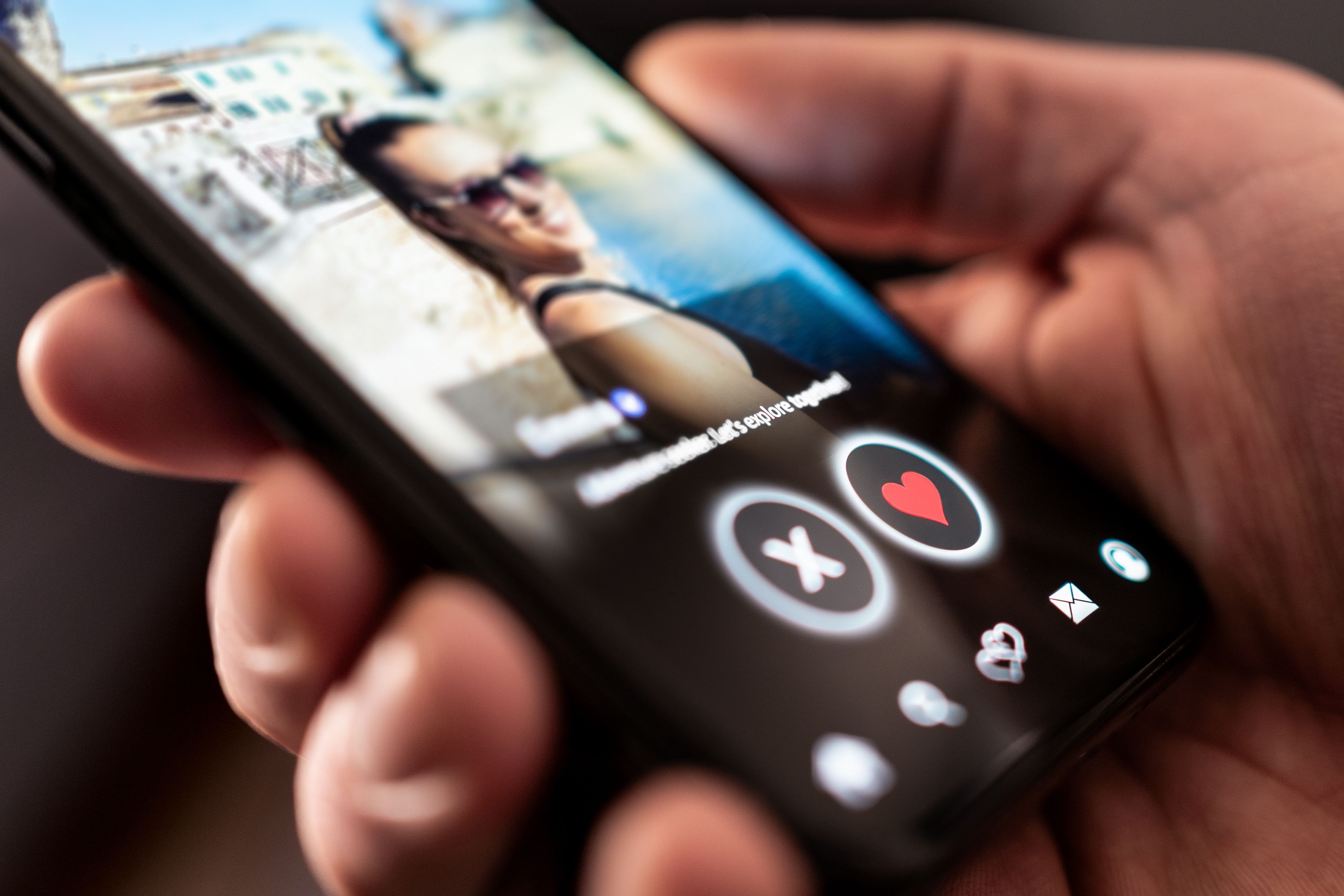 Date app, online site. Swipe for love and relationship. Right or left. Profile photo of a woman. Man with phone. Match on mobile application or website on internet.