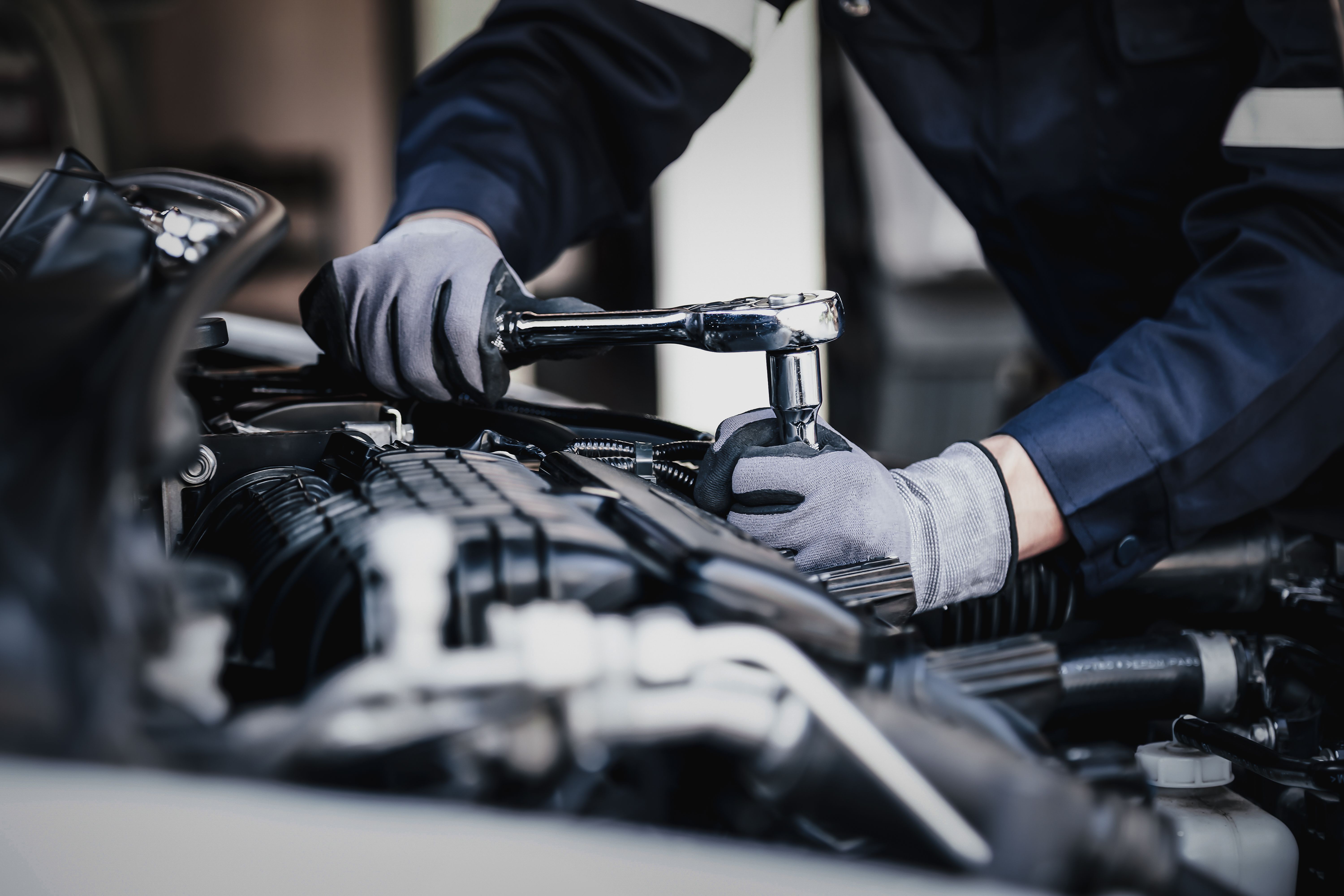 mechanic checking engine