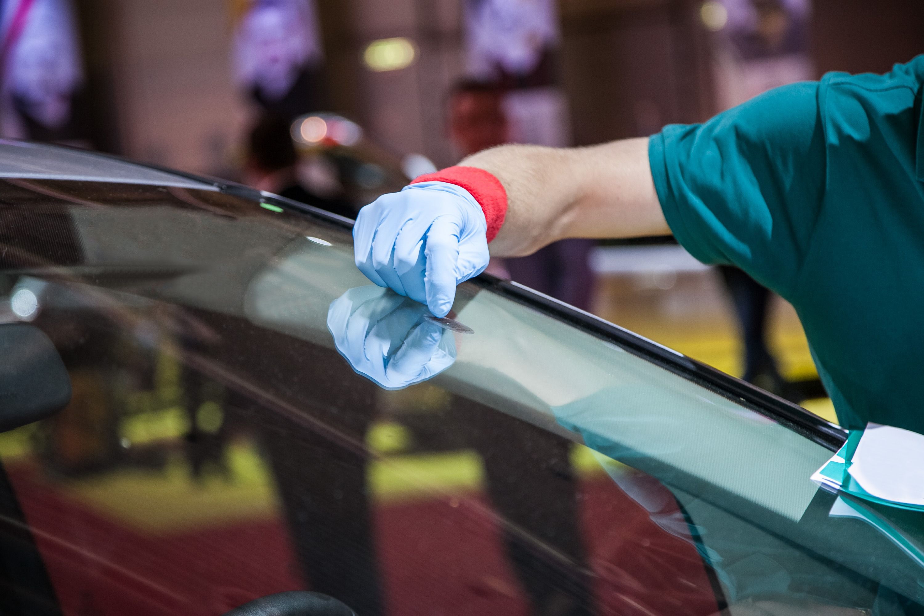 technician repairing windshield