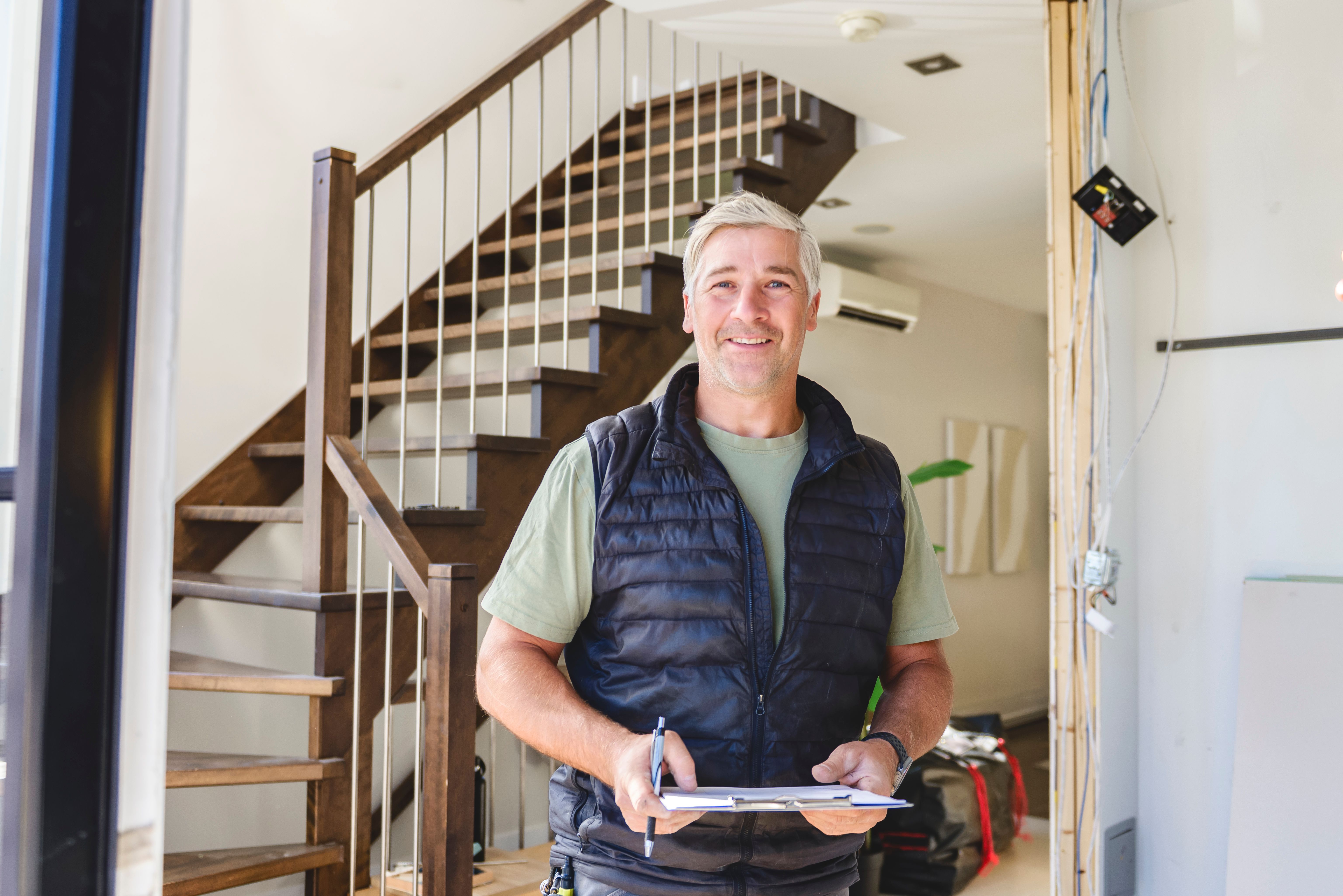 Electrician worker inside house. Construction decoration concept.