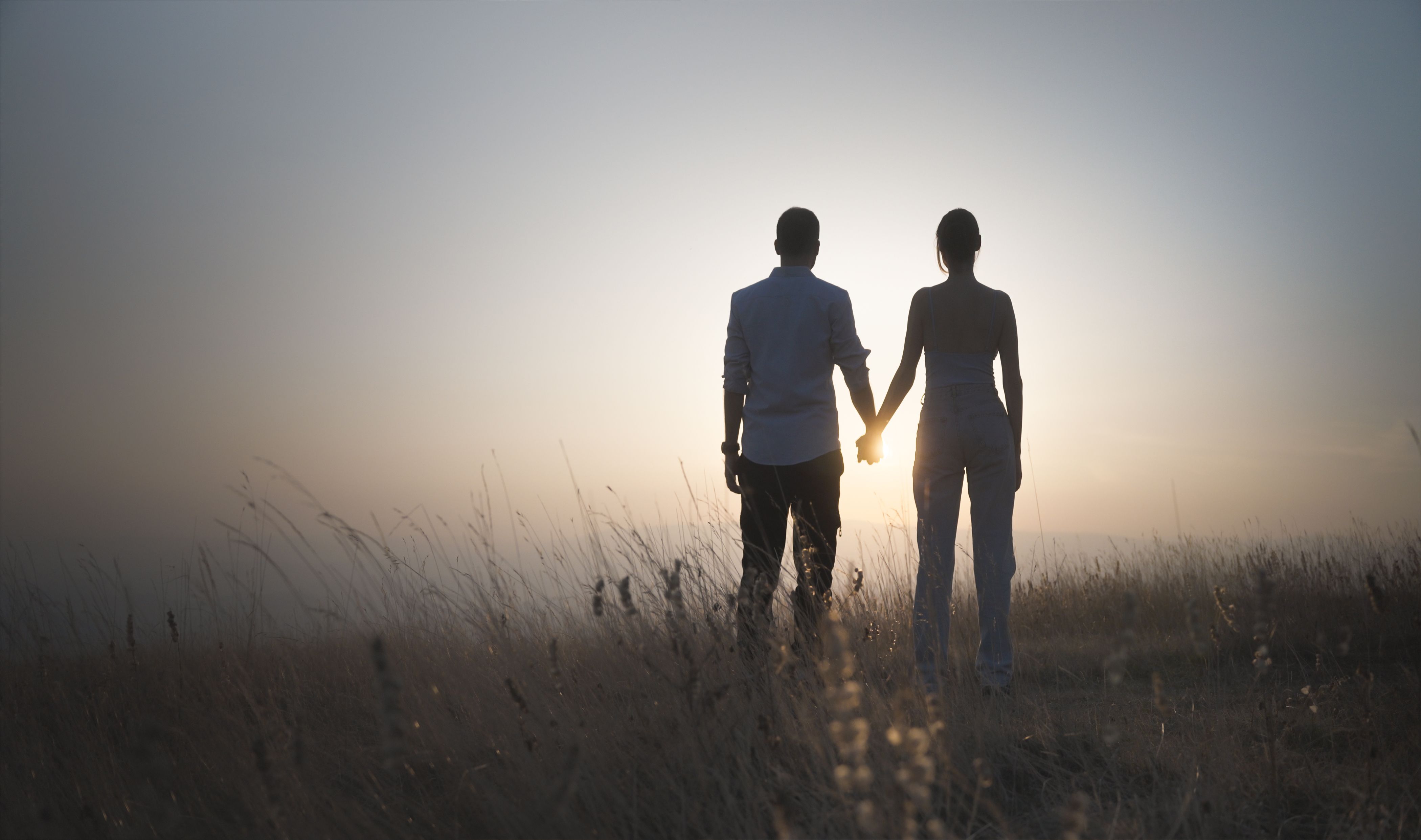 Couple in love holding hands in great outdoors