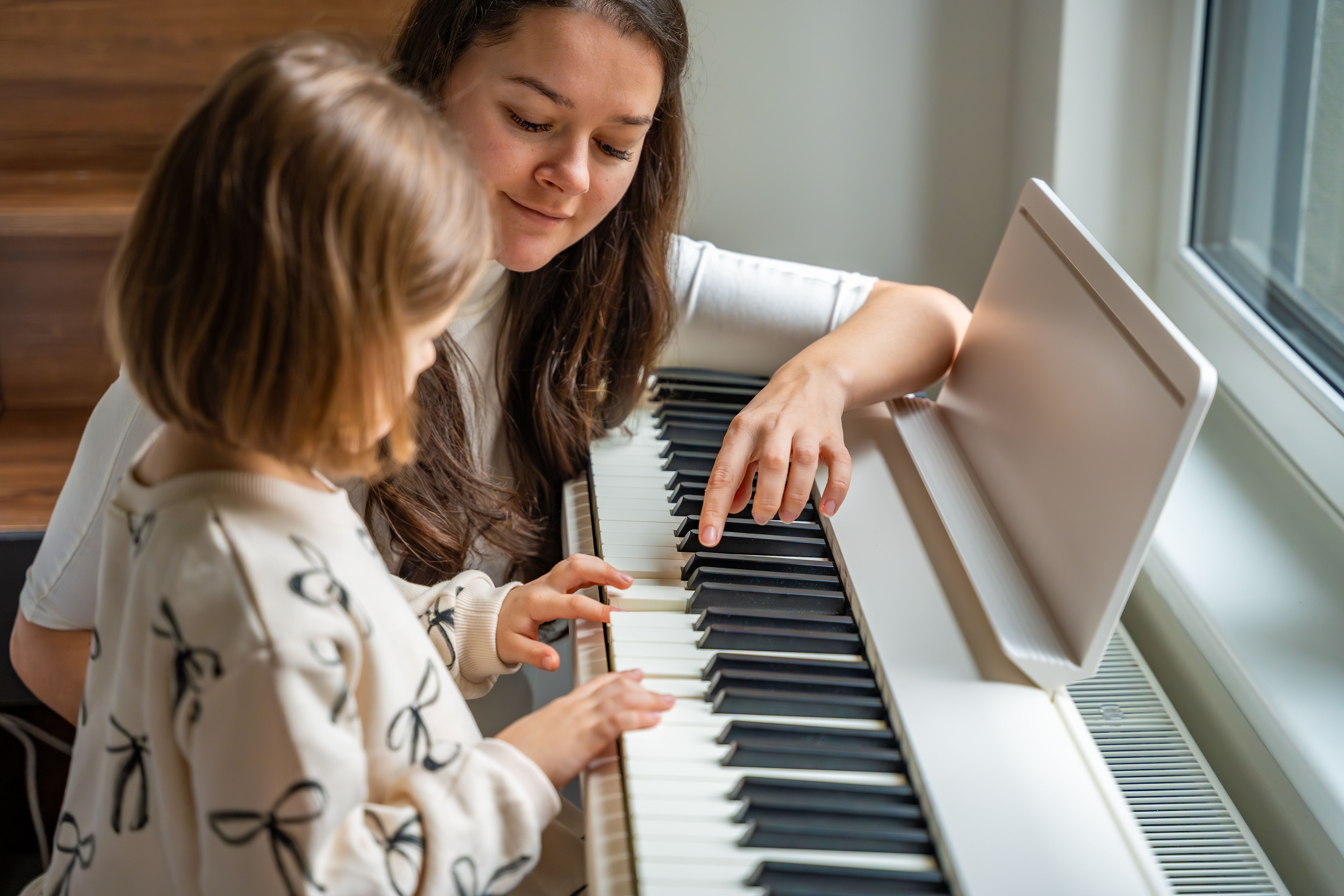 child learning piano