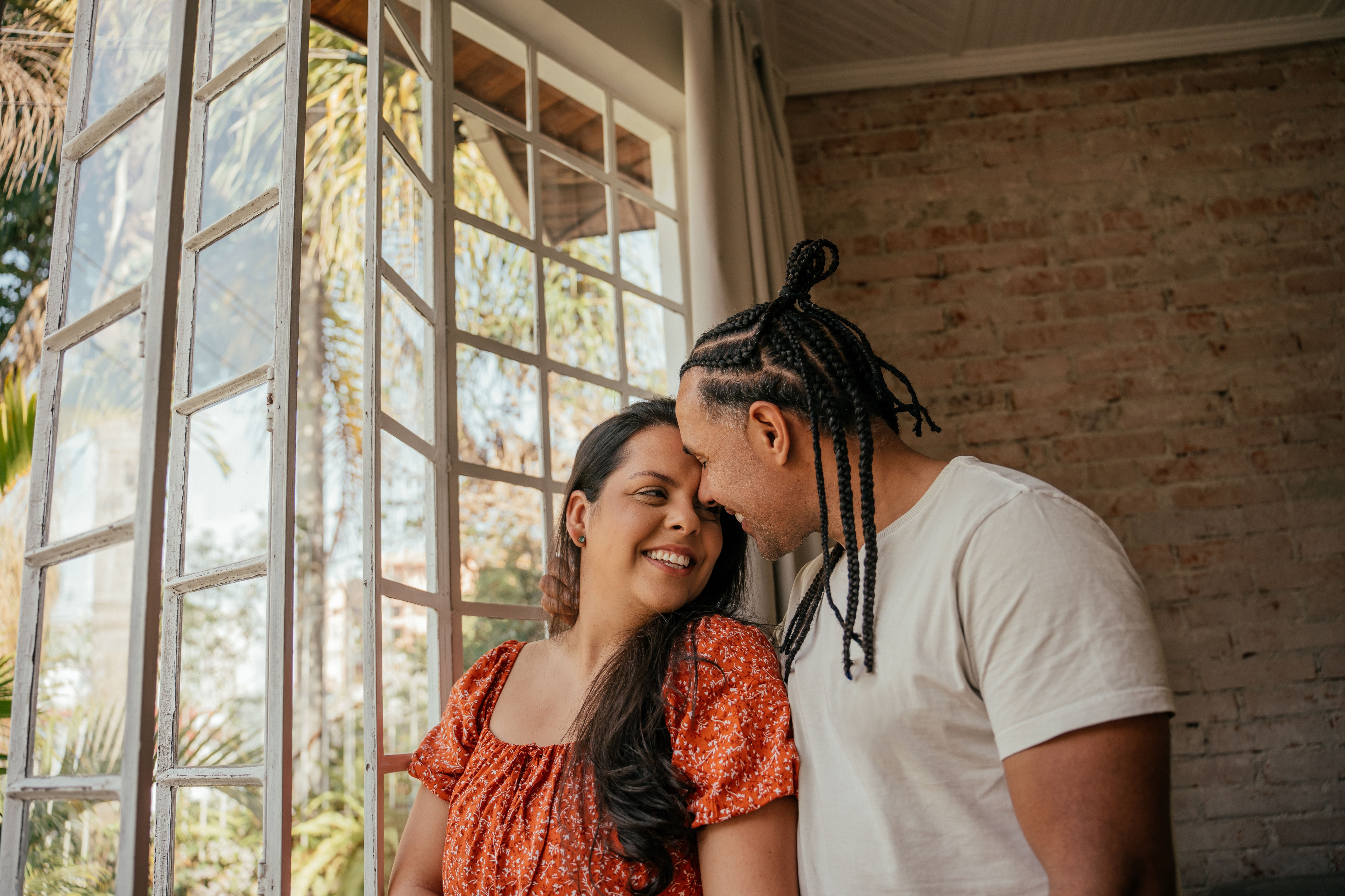 Couple hugging in the window