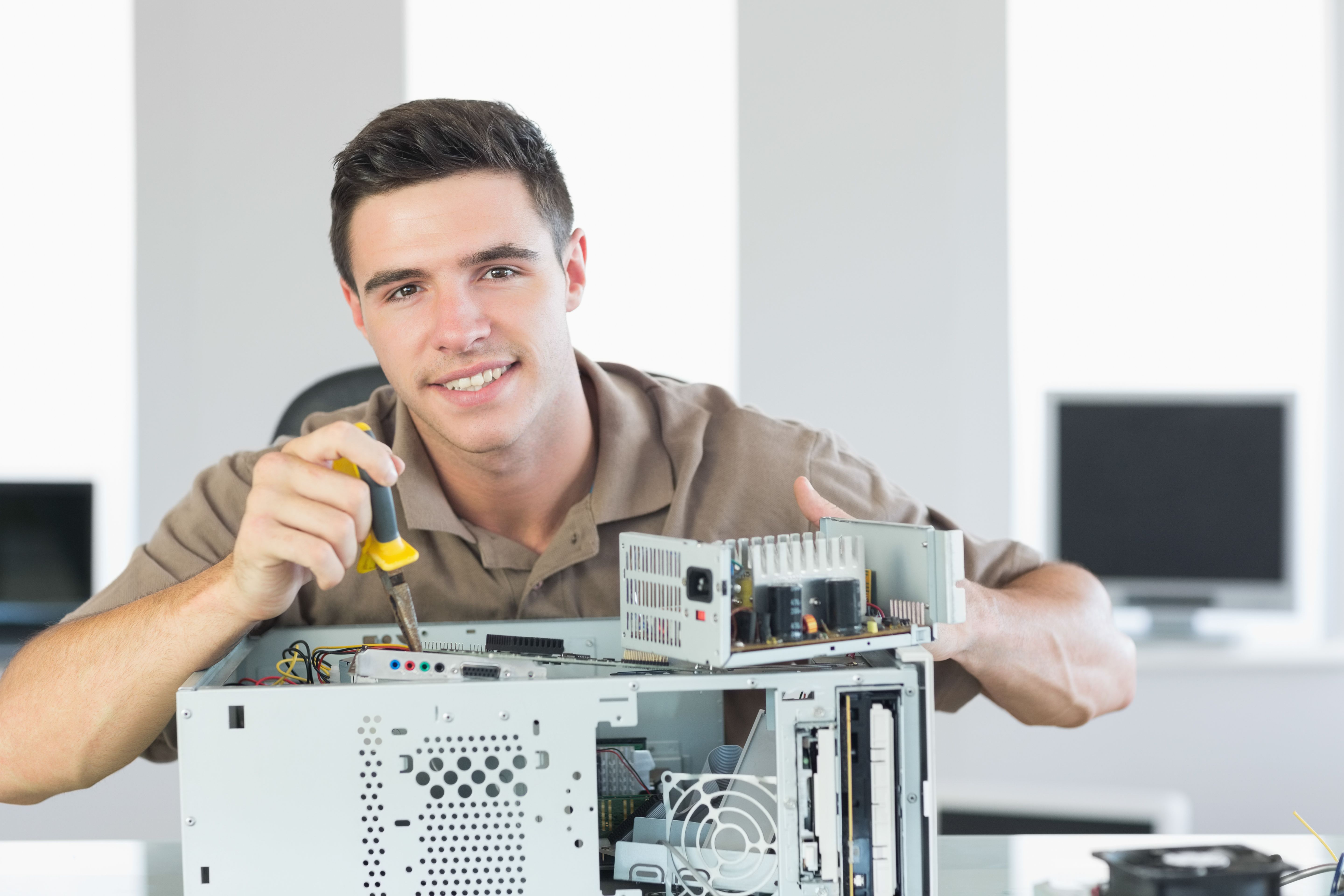 technician fixing computer