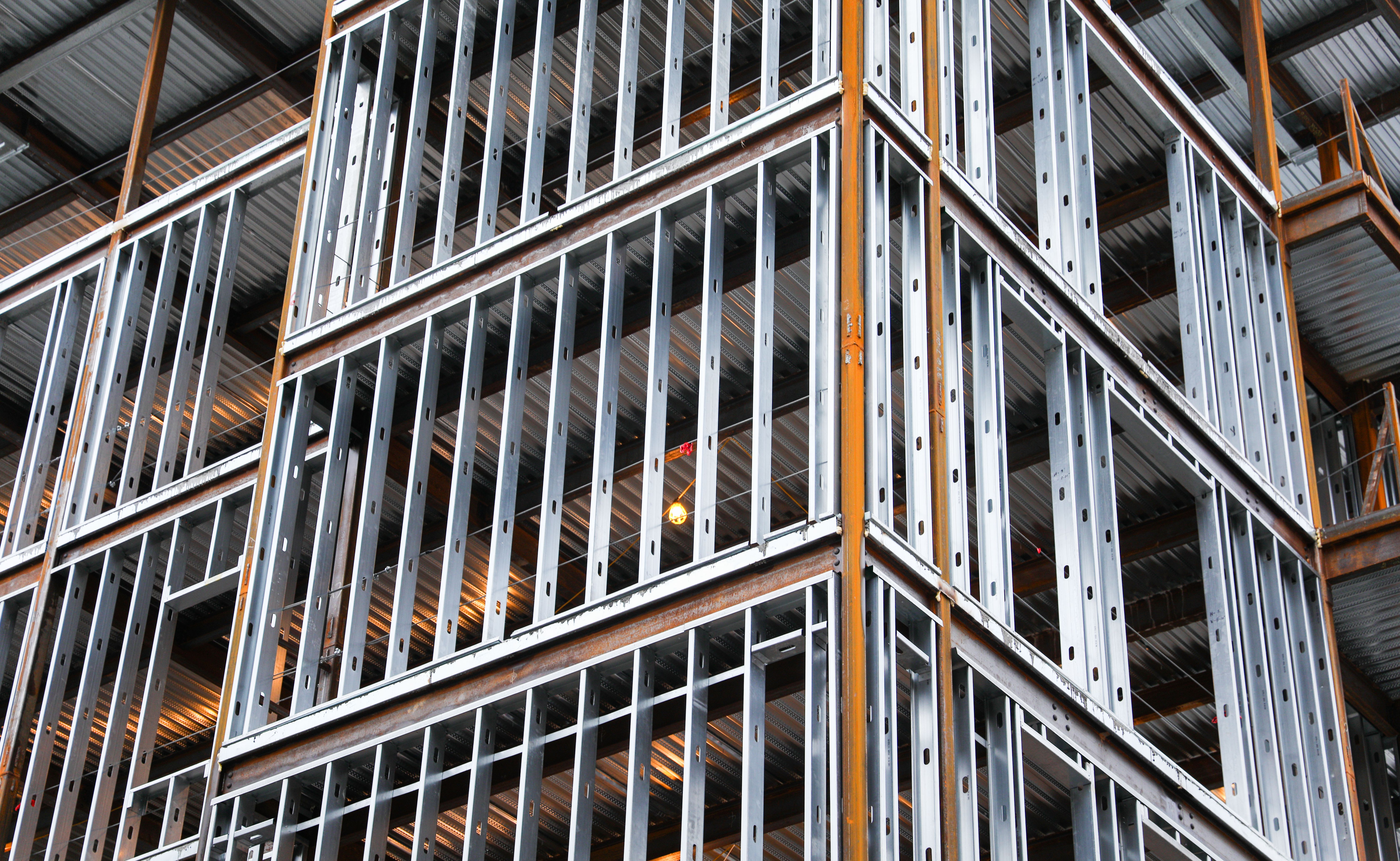 construction site scene with workers, machinery, and progress, showcasing industrious activity and urban development