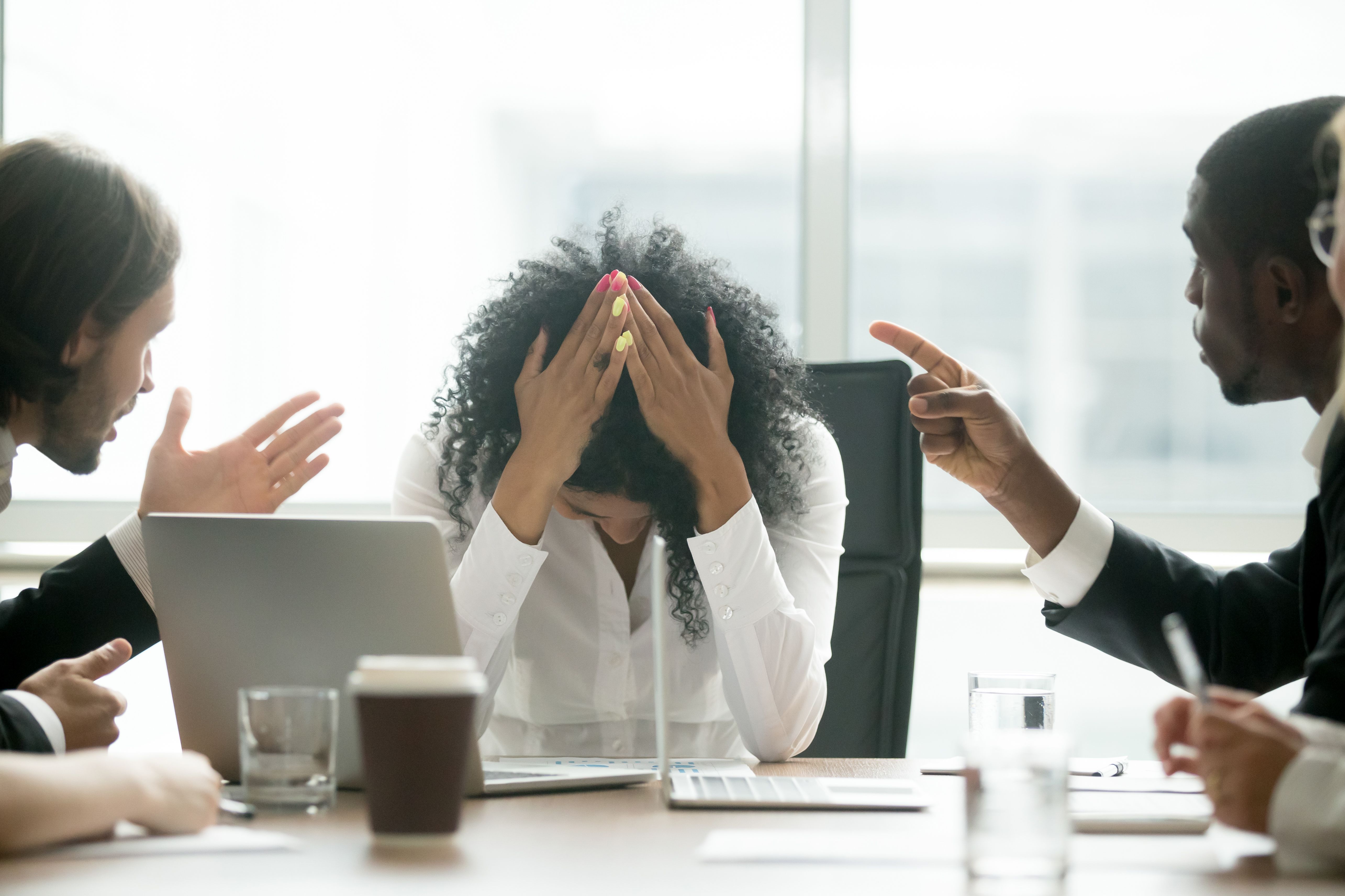 Depressed black woman leader suffering from gender discrimination at work Depressed black woman leader suffering from gender discrimination at work