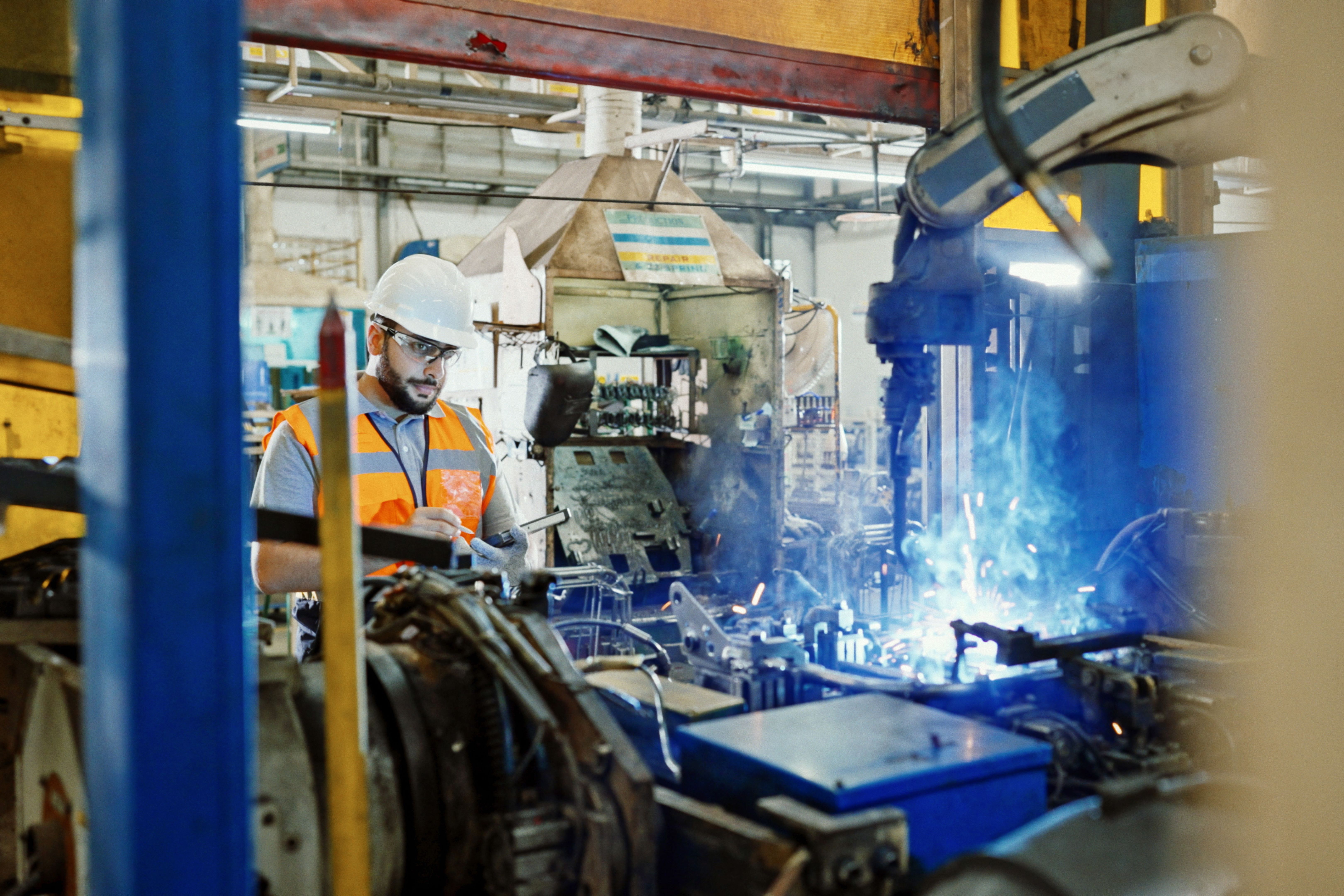 Professional Engineer working in the automated manufacturing factory Professional Engineer working in the automated manufacturing factory