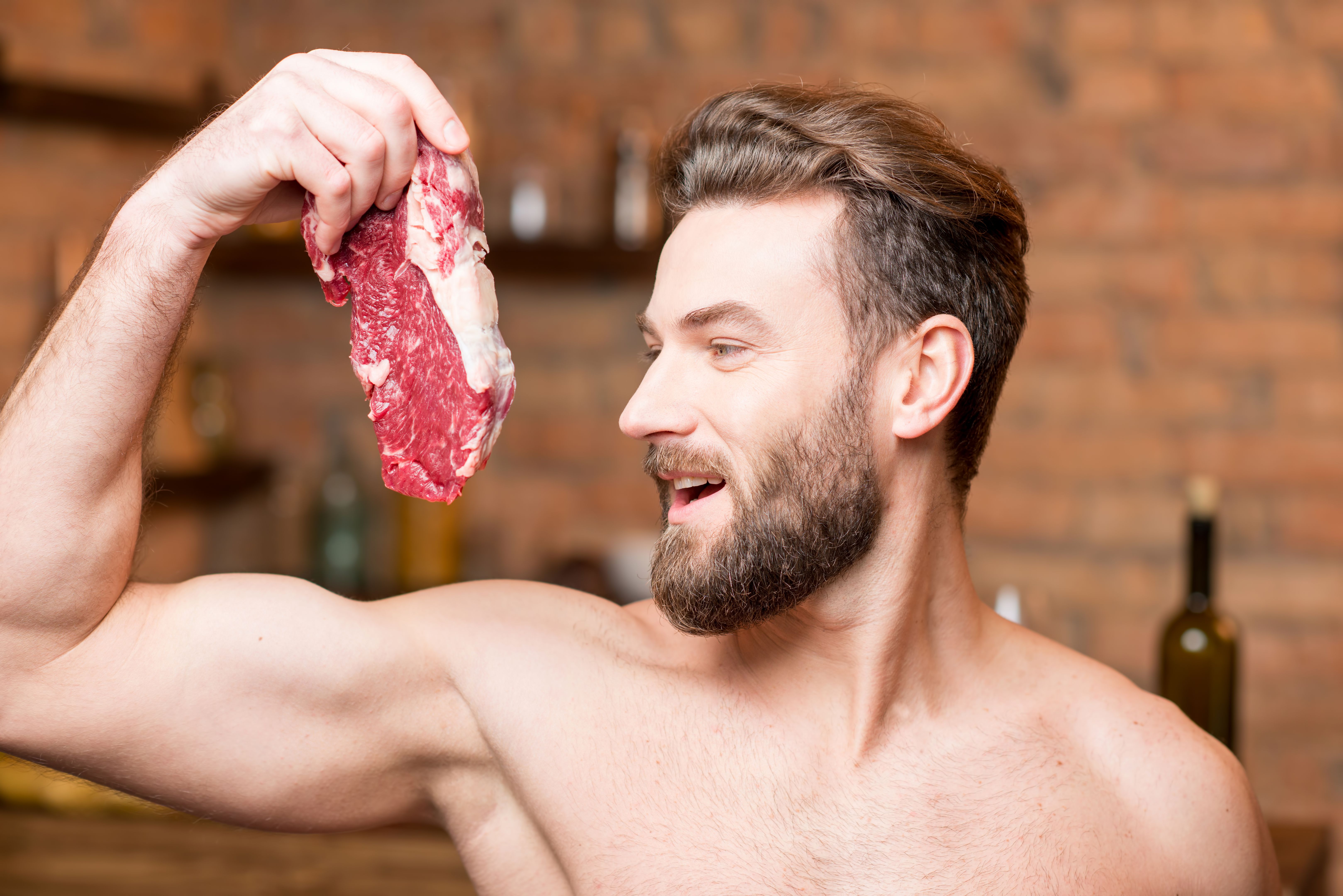 Muscular man with raw meat