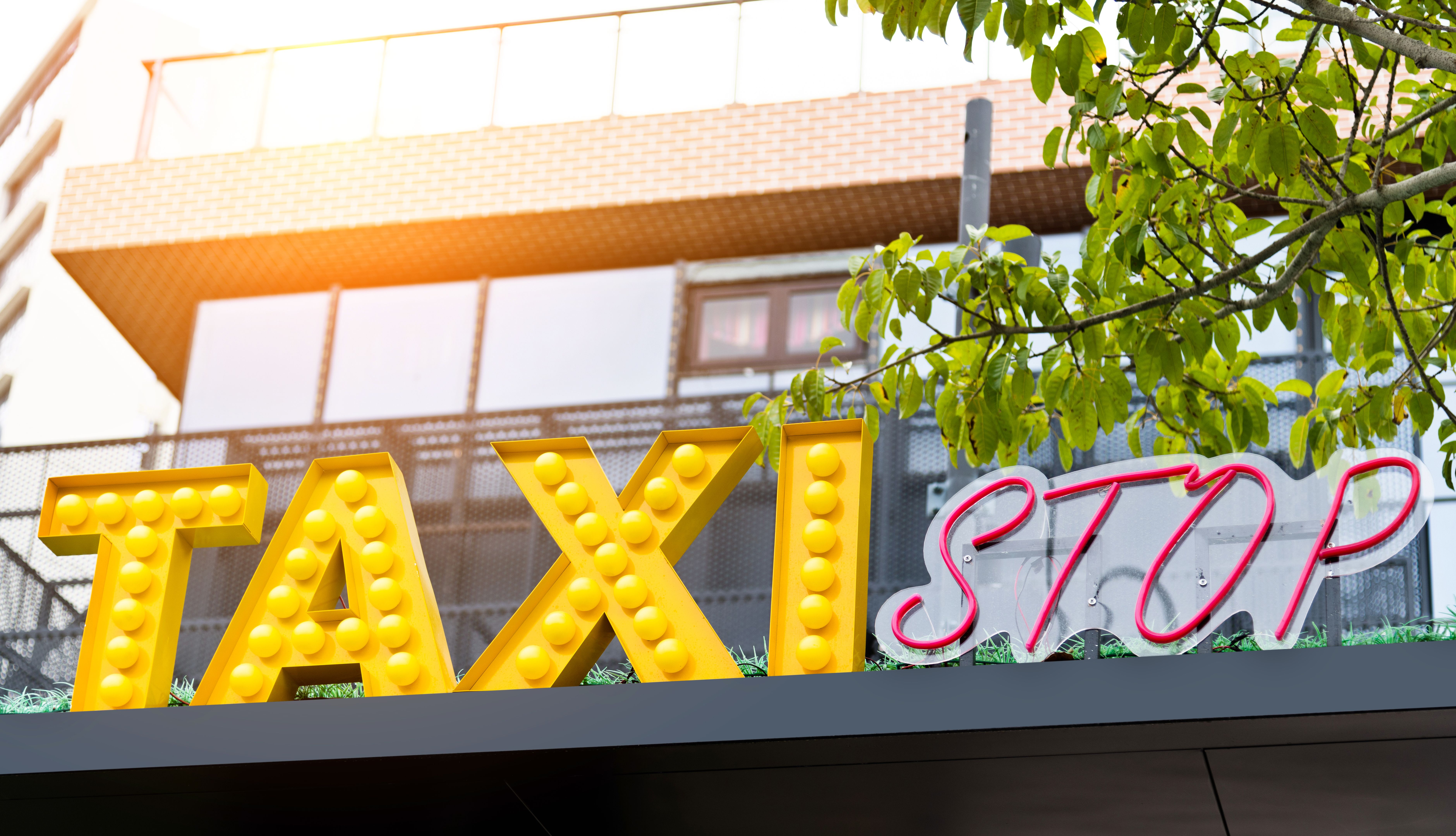 Taxi stand sign on top of building Taxi stand sign on top of building