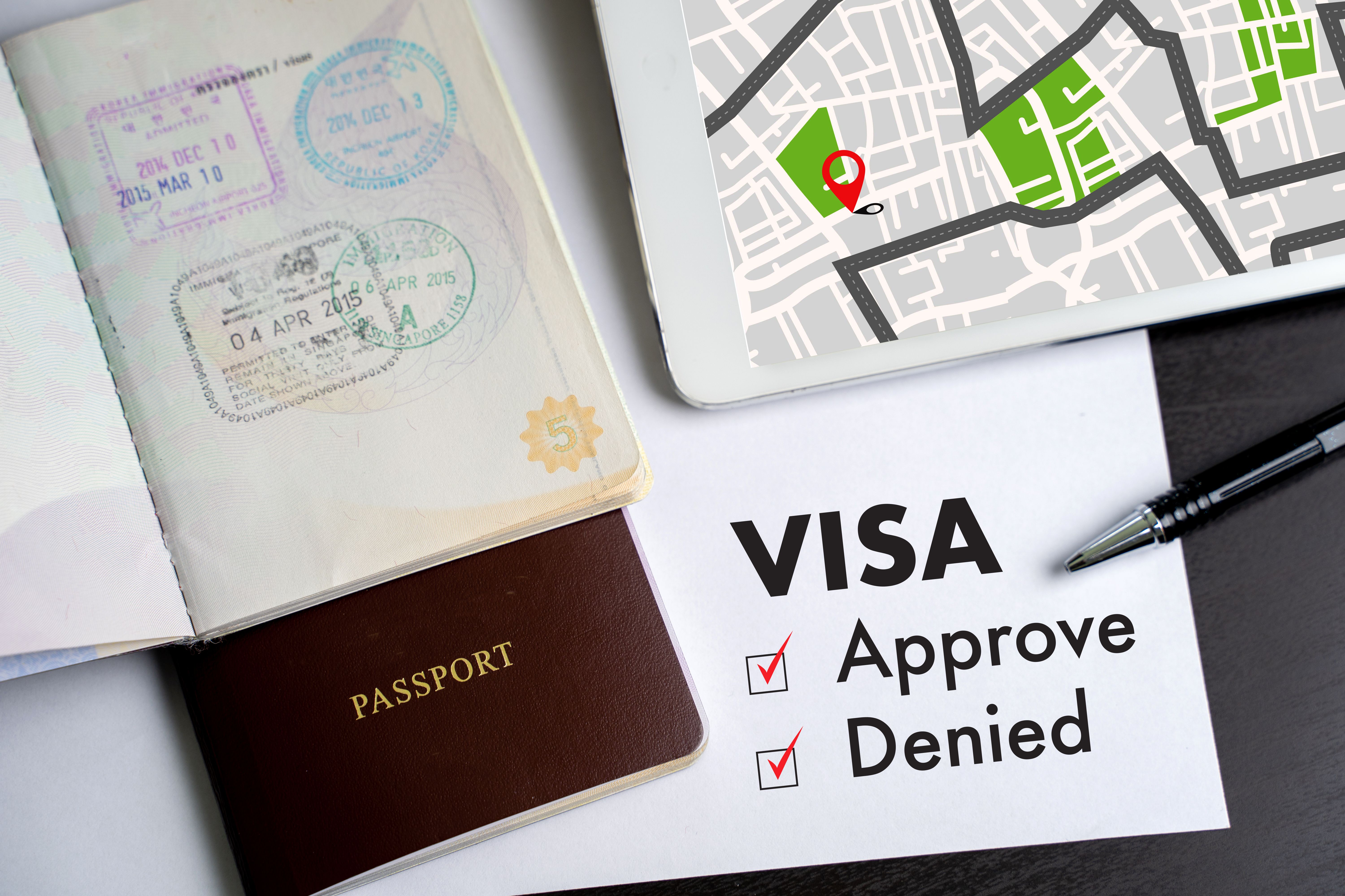 Visa and passport to approved stamped on a document top view in Immigration Visa approve