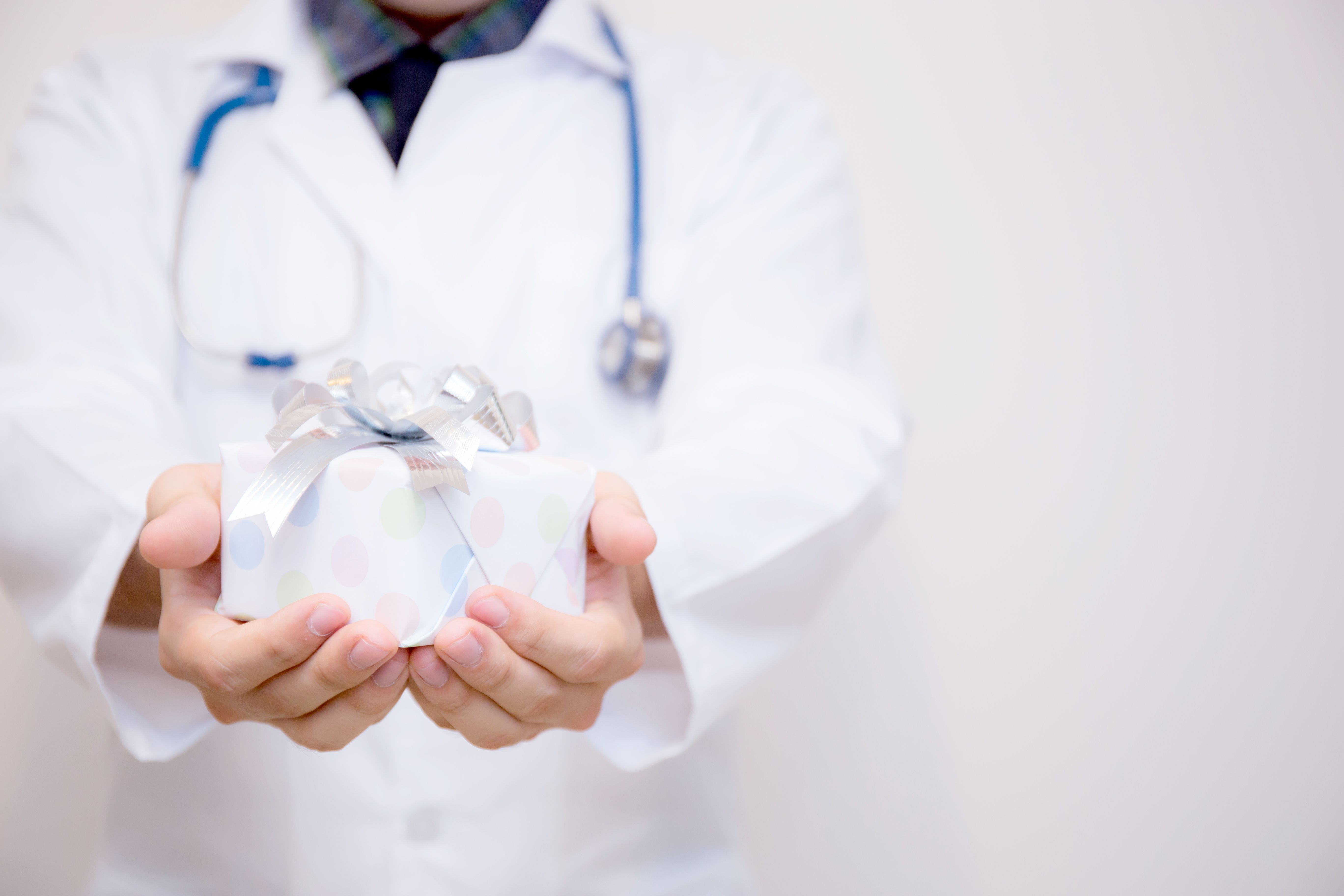 doctor presenting gift