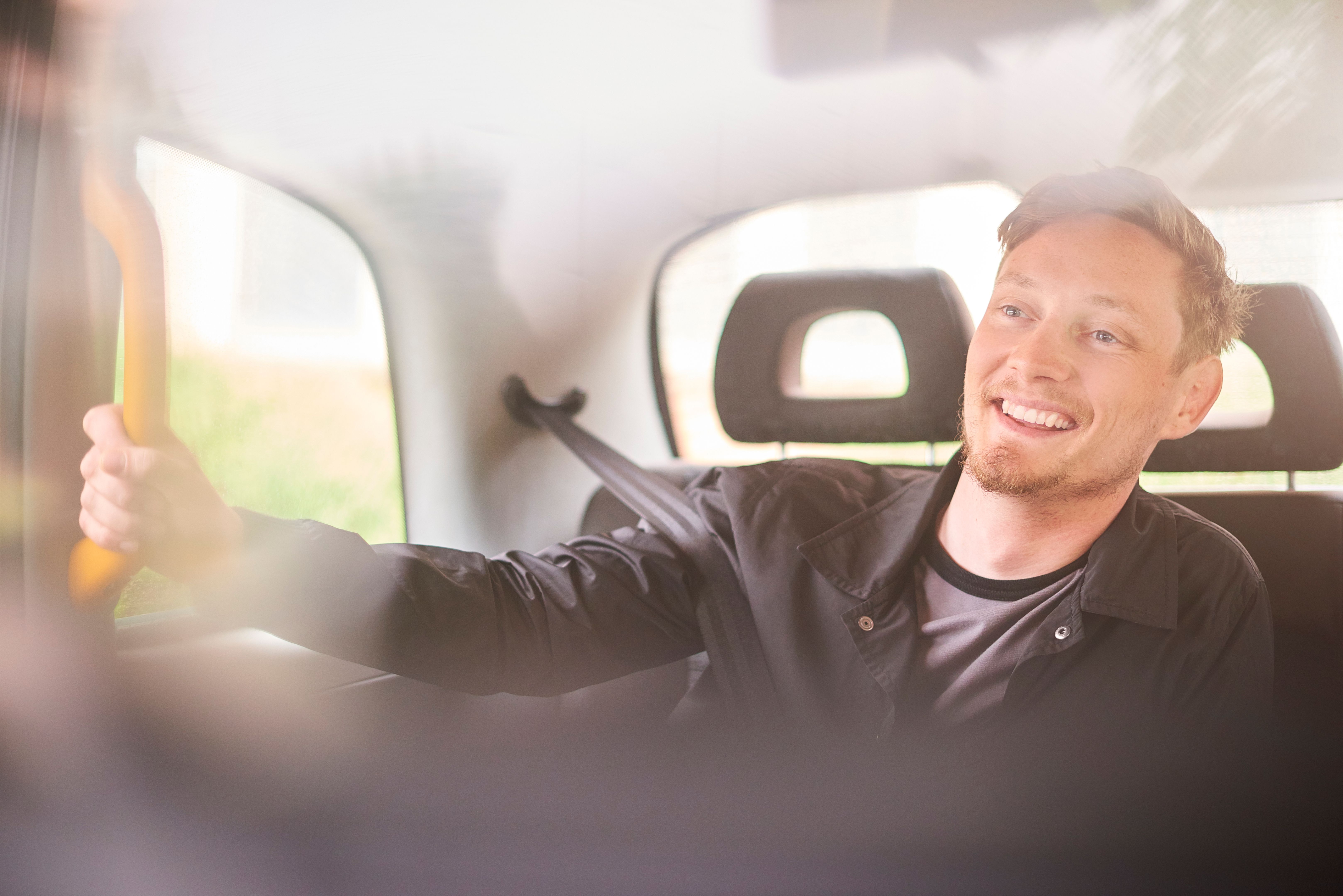 young man in a black cab