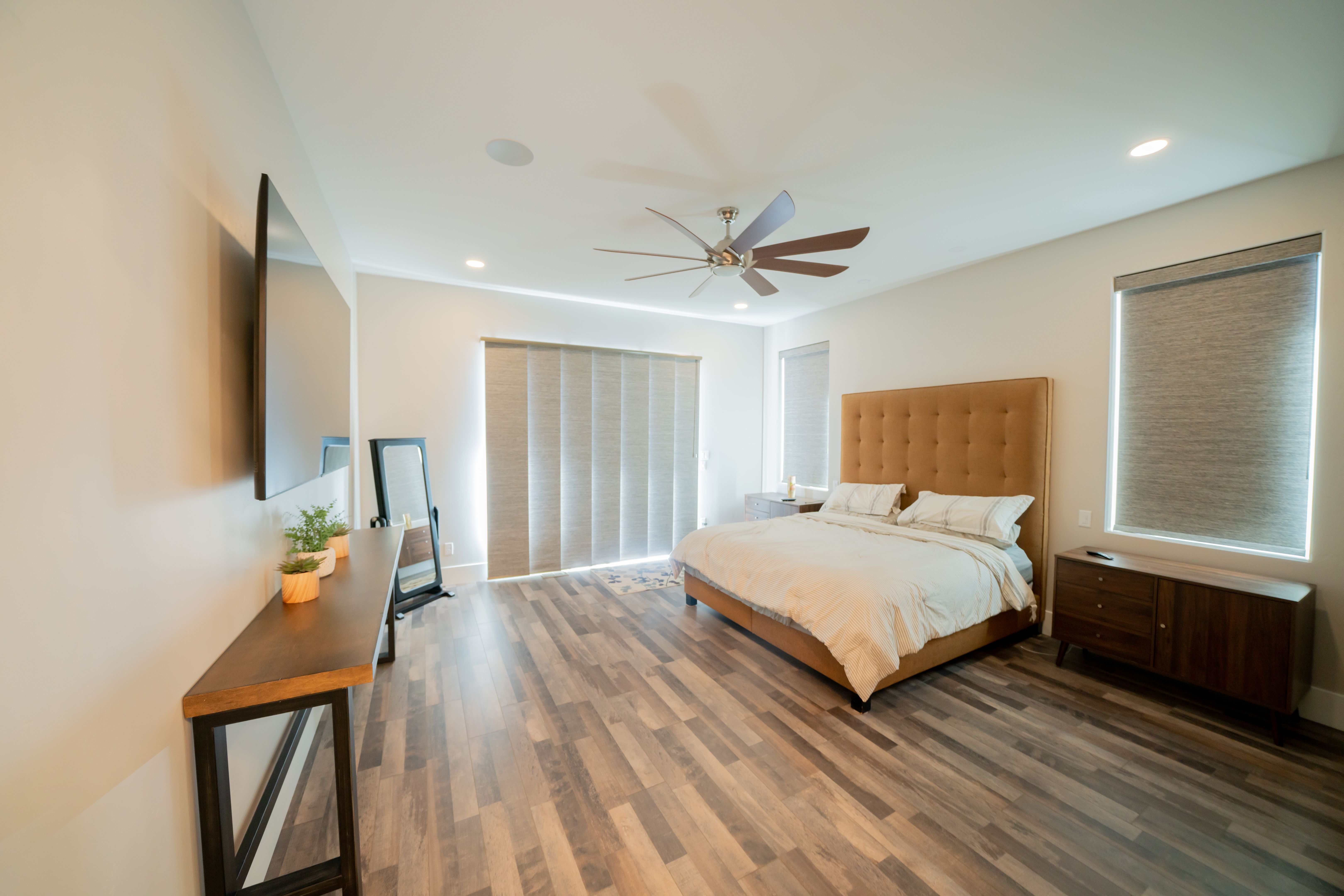 Fashionable Modern Bedroom in an Executive New Home with Ceiling Fan and Air Conditioning Fashionable Modern Bedroom in an Executive New Home with Ceiling Fan and Air Conditioning
