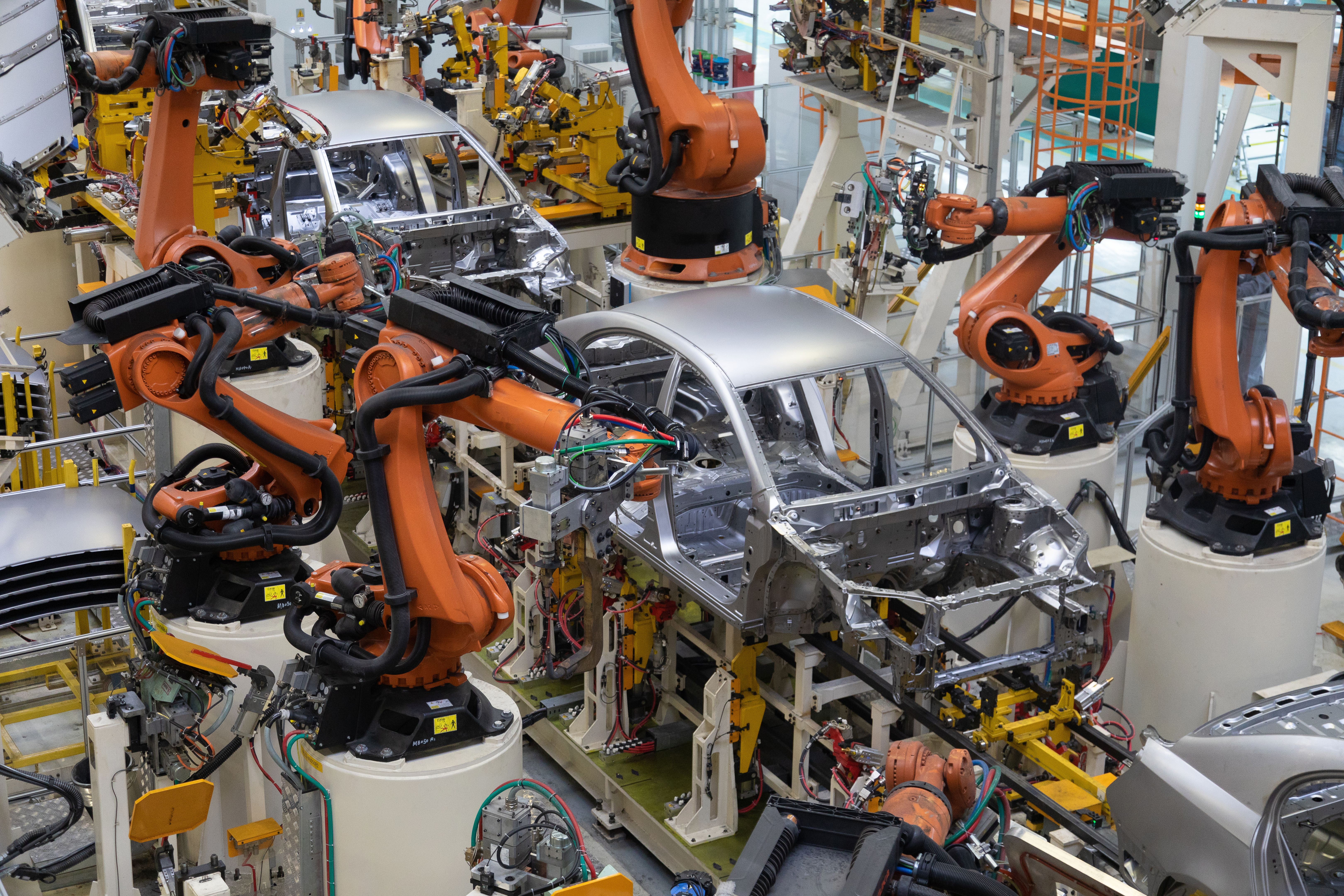 body of car on conveyor top view. Modern Assembly of cars at the plant. The automated build process of the car body