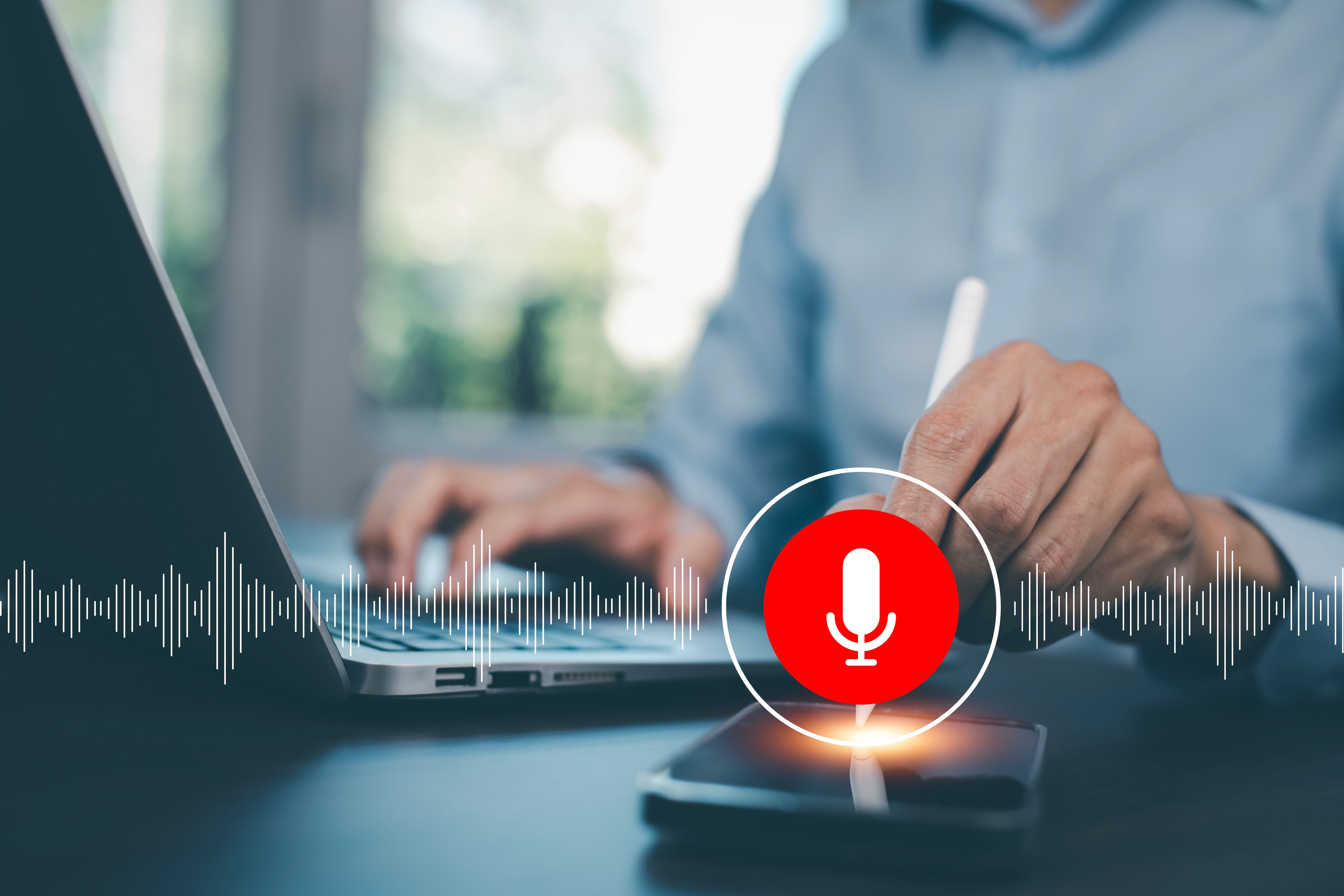 Businessman using smartphone touch microphone button on virtual screen. Blog blog speak talk advertising presentation,Voice recognition, speech detection and deep learning application,Voice Assistance