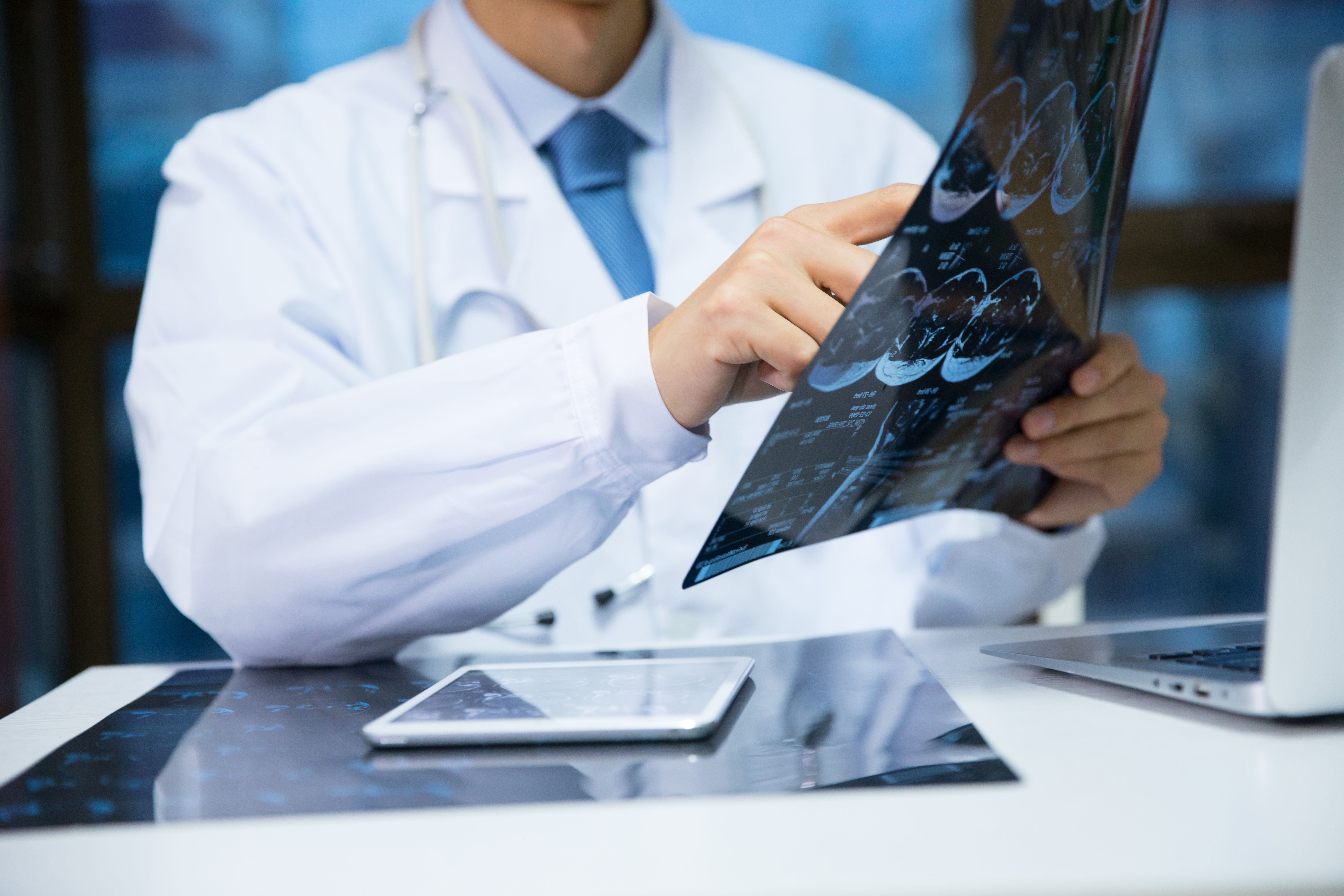 doctor examining scans