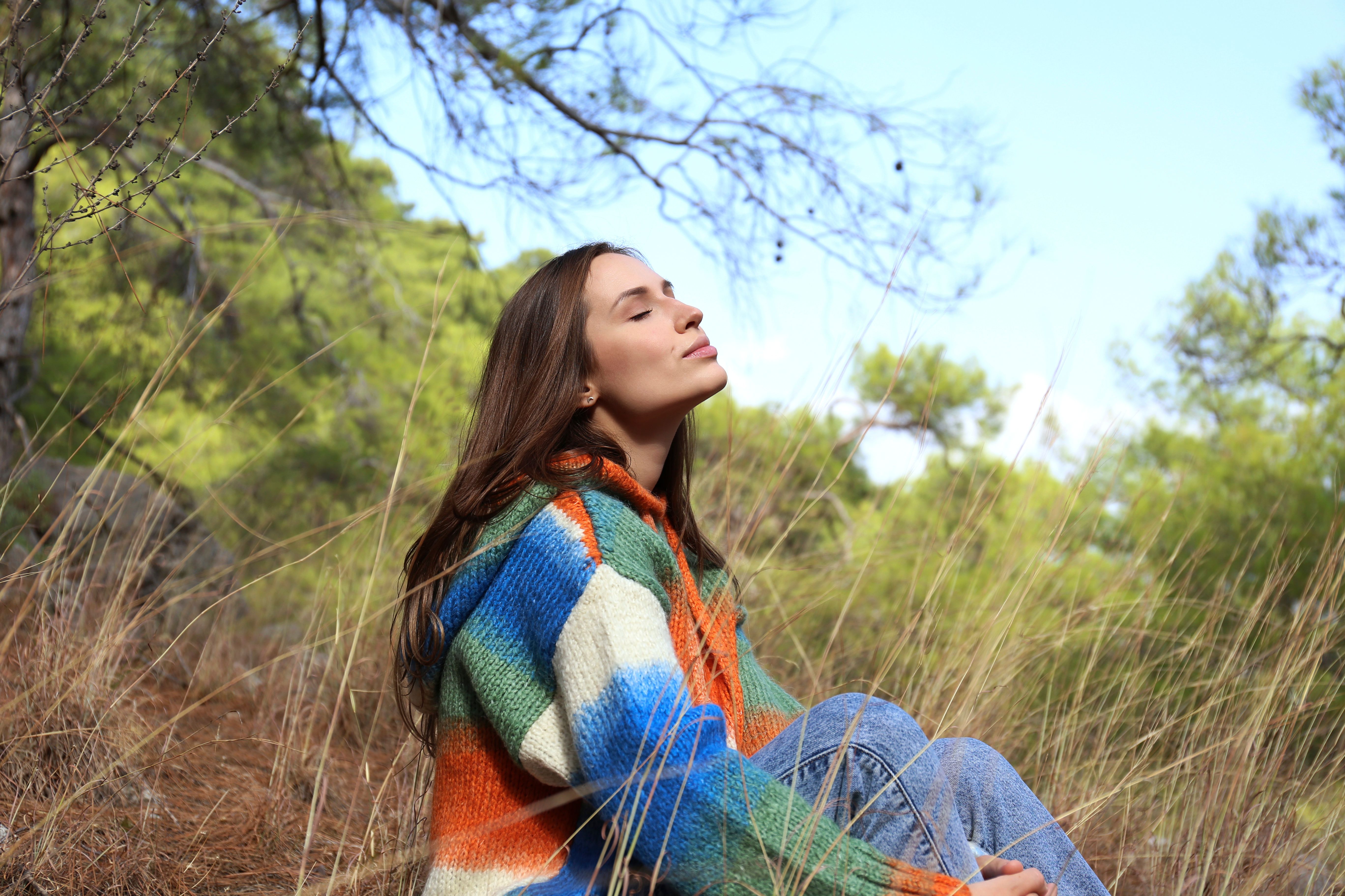 Carefree young woman enjoying the nature.