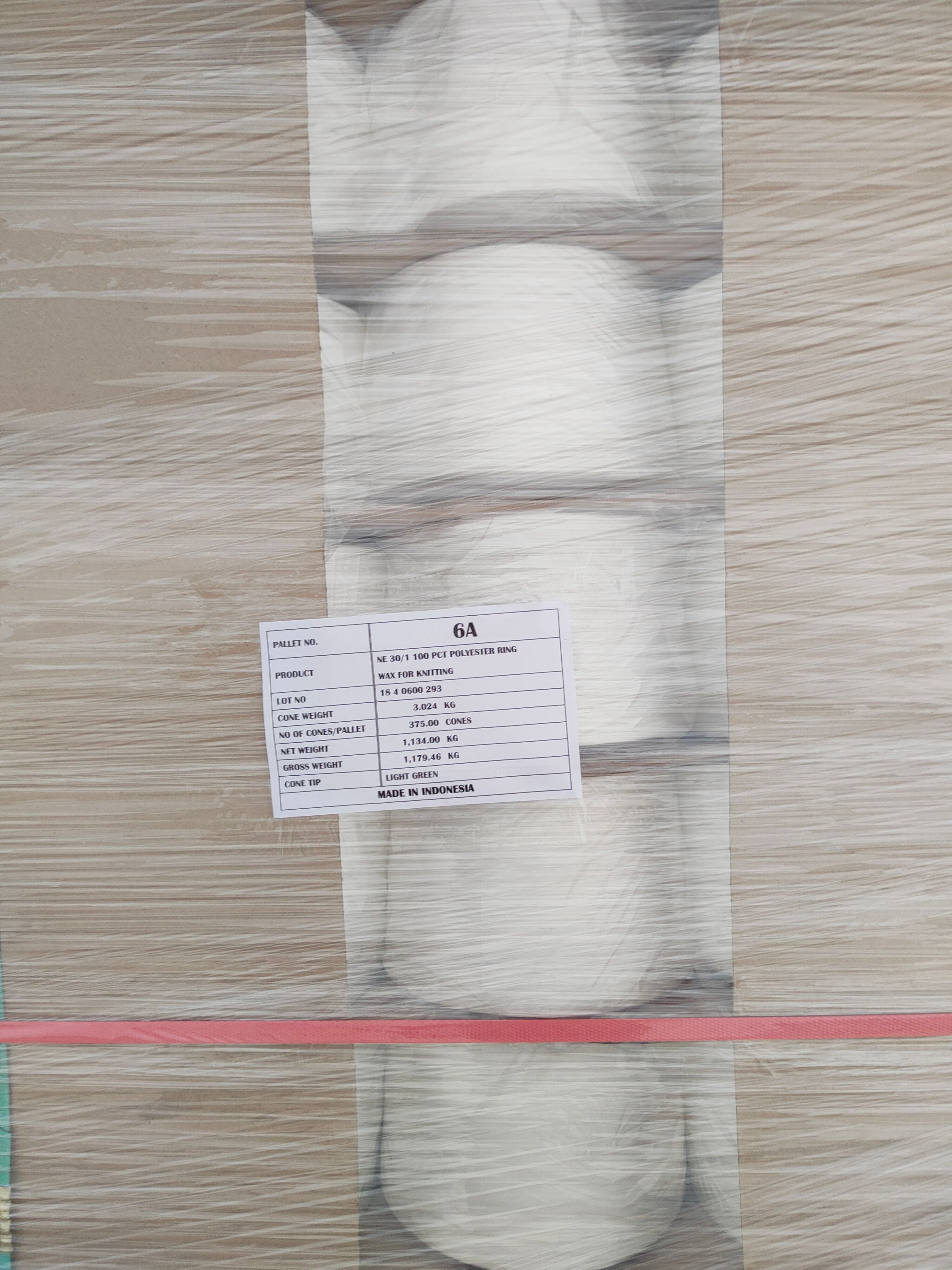 Textile products in the form of rolls of yarn that are ready to be sent to customers.