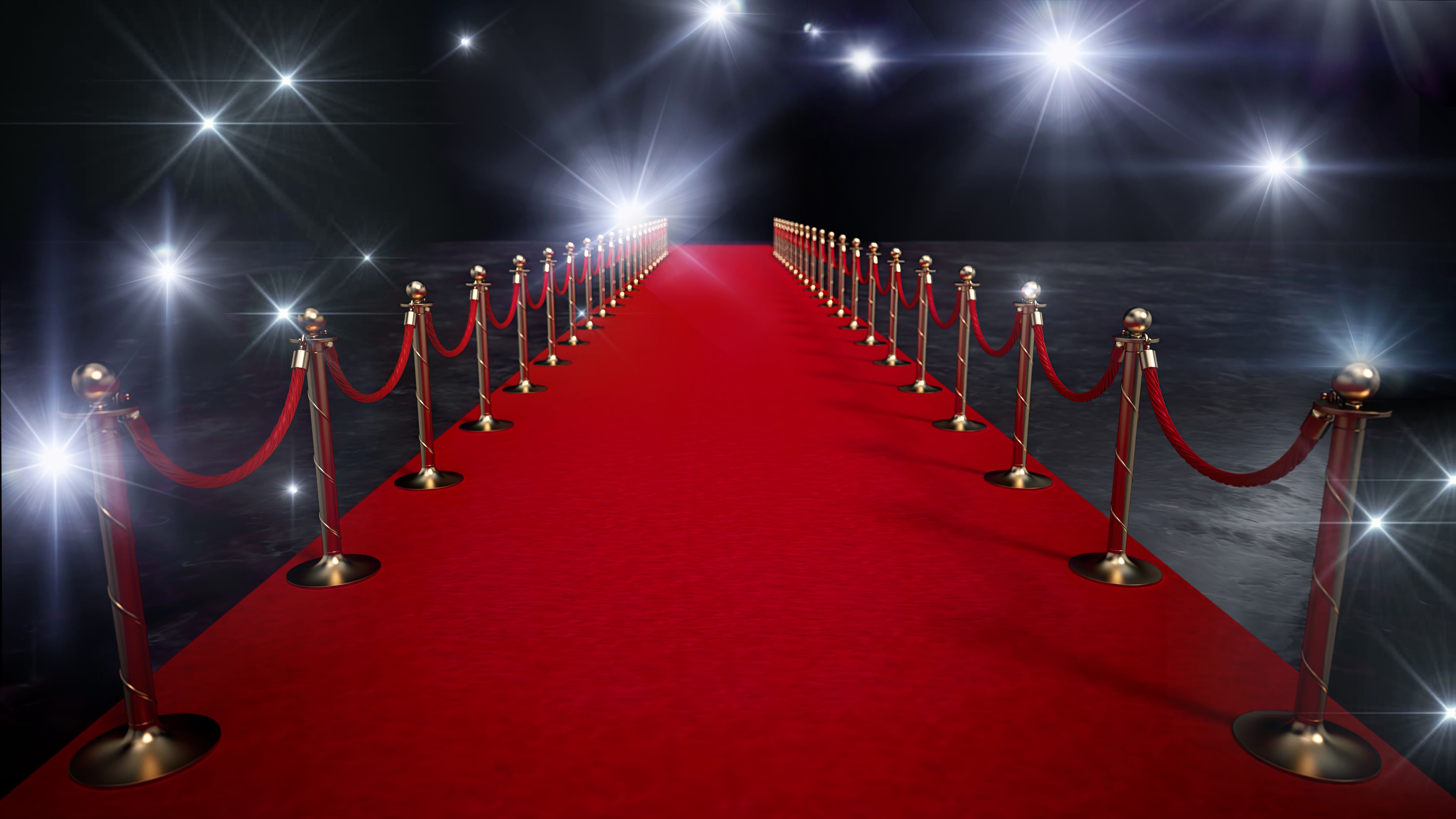 Red Carpet Entrance With Golden Stanchions, Velvet Ropes and White Flashlights