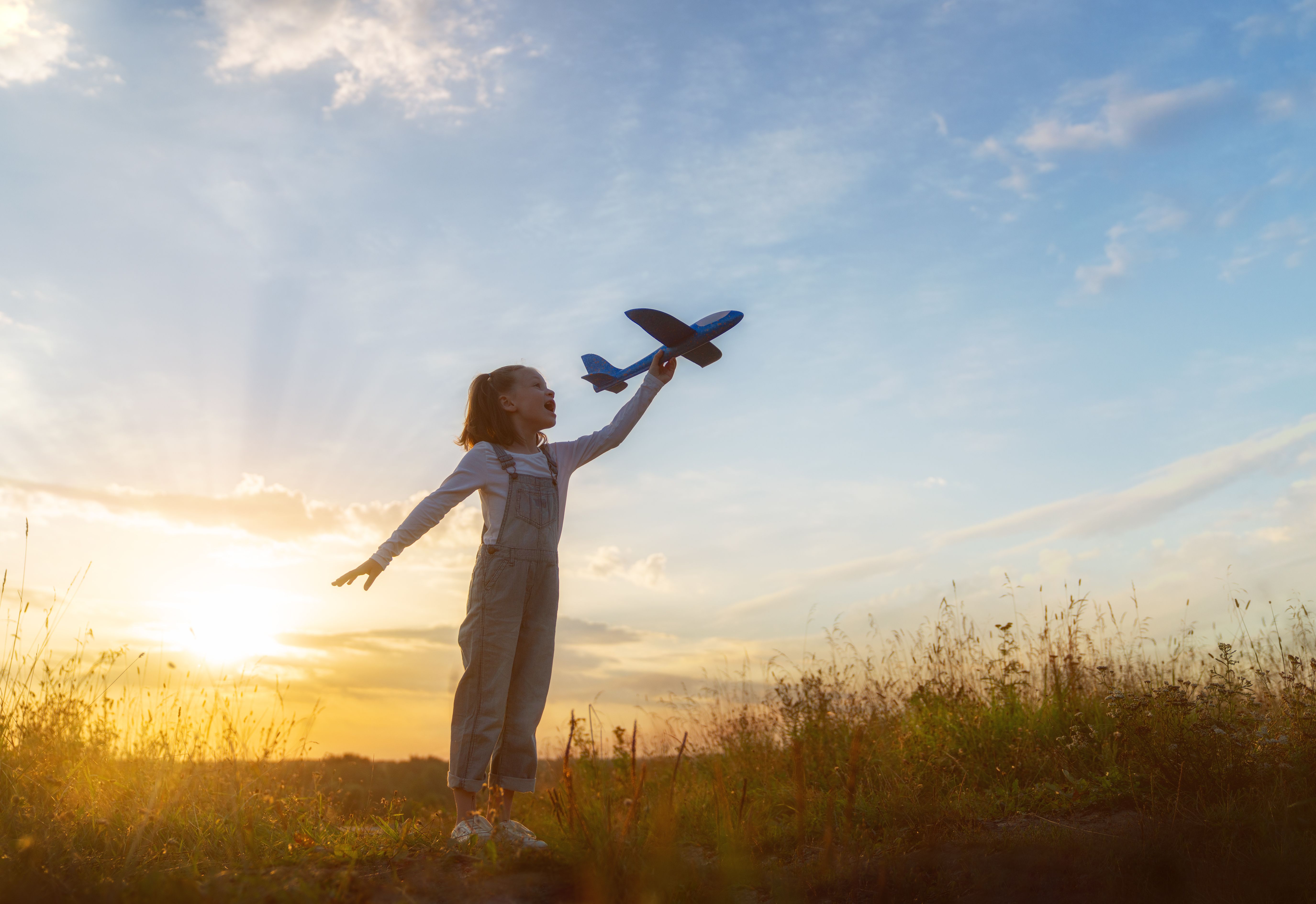 child playing airplane