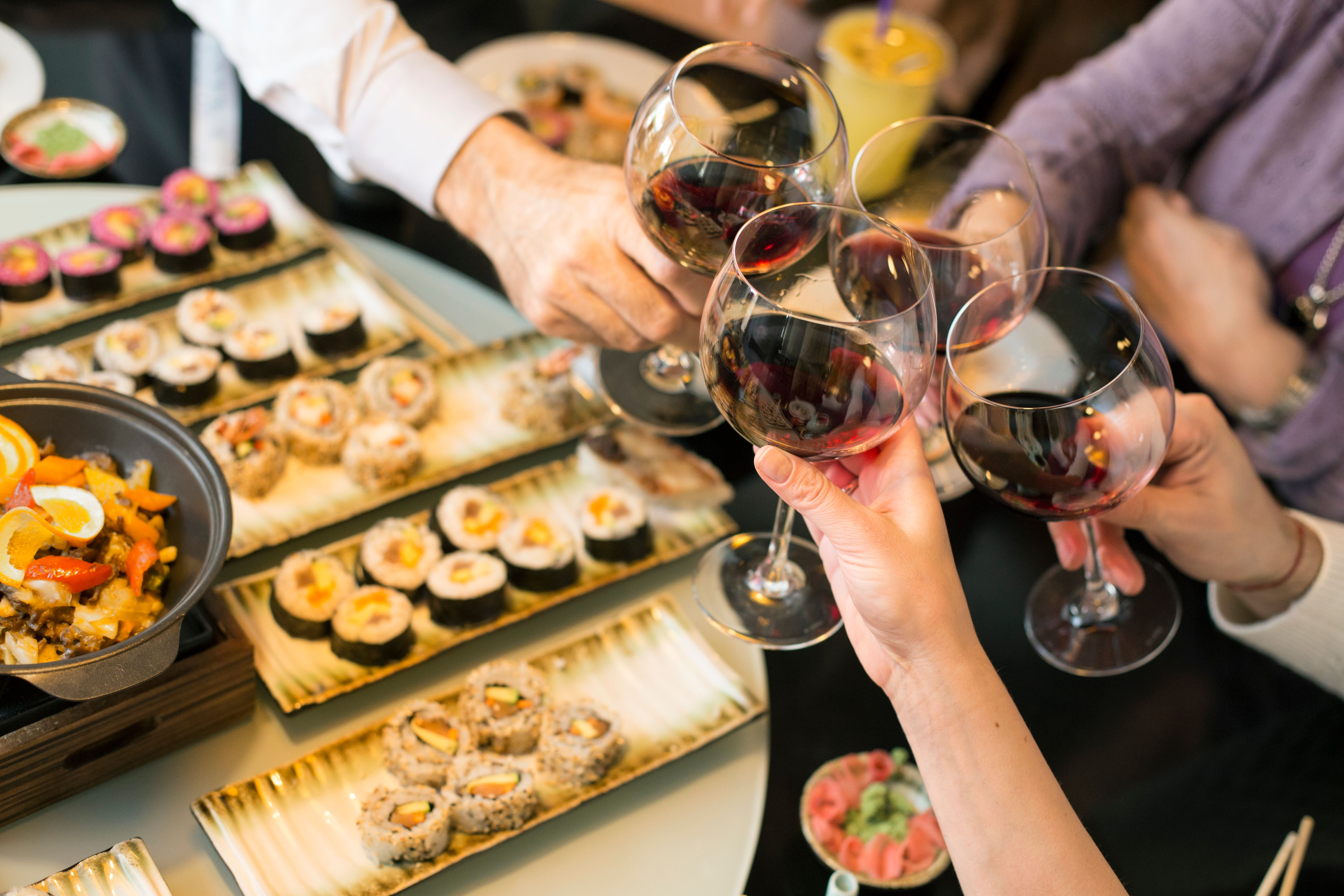 people enjoying sushi