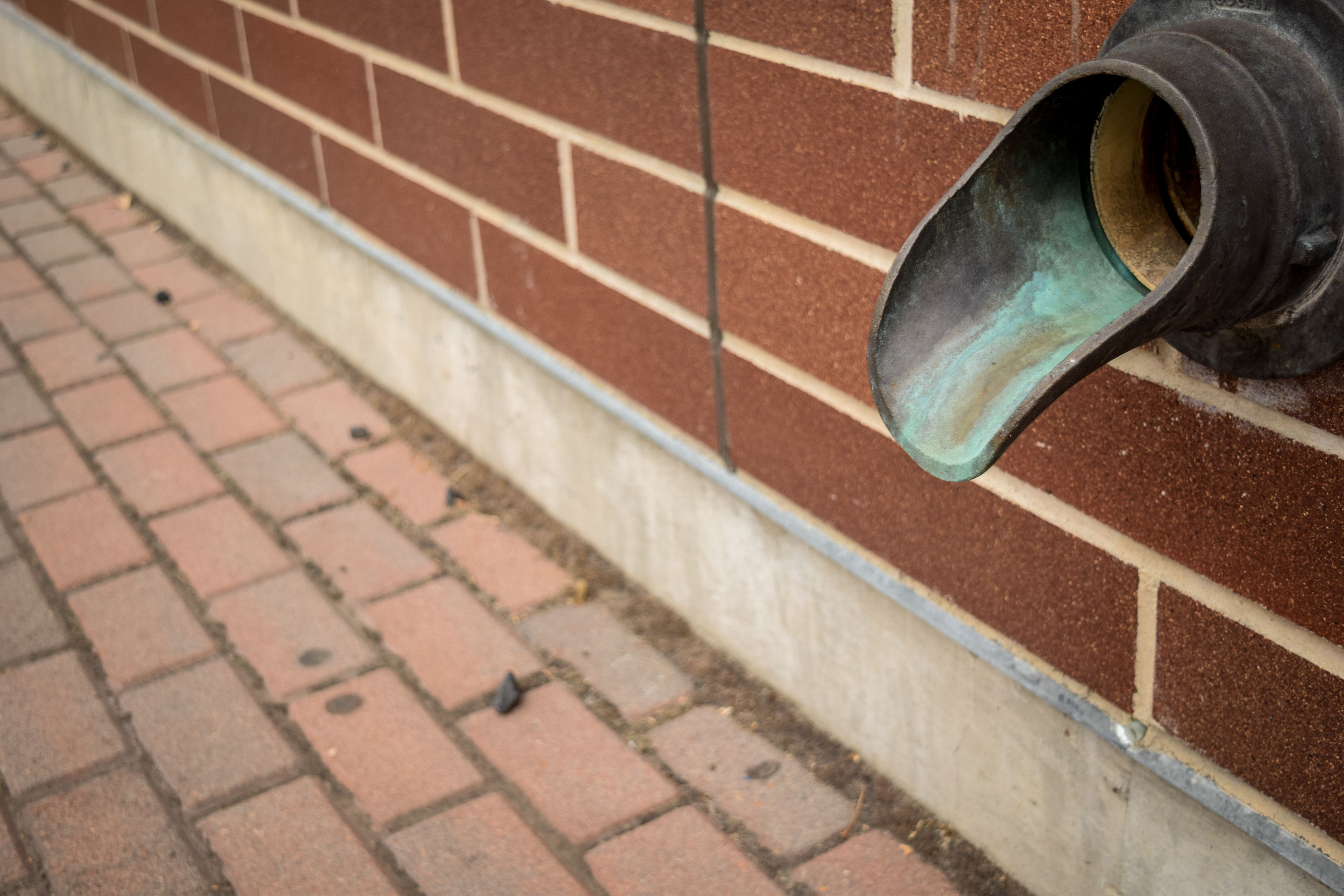 unclogging downspout