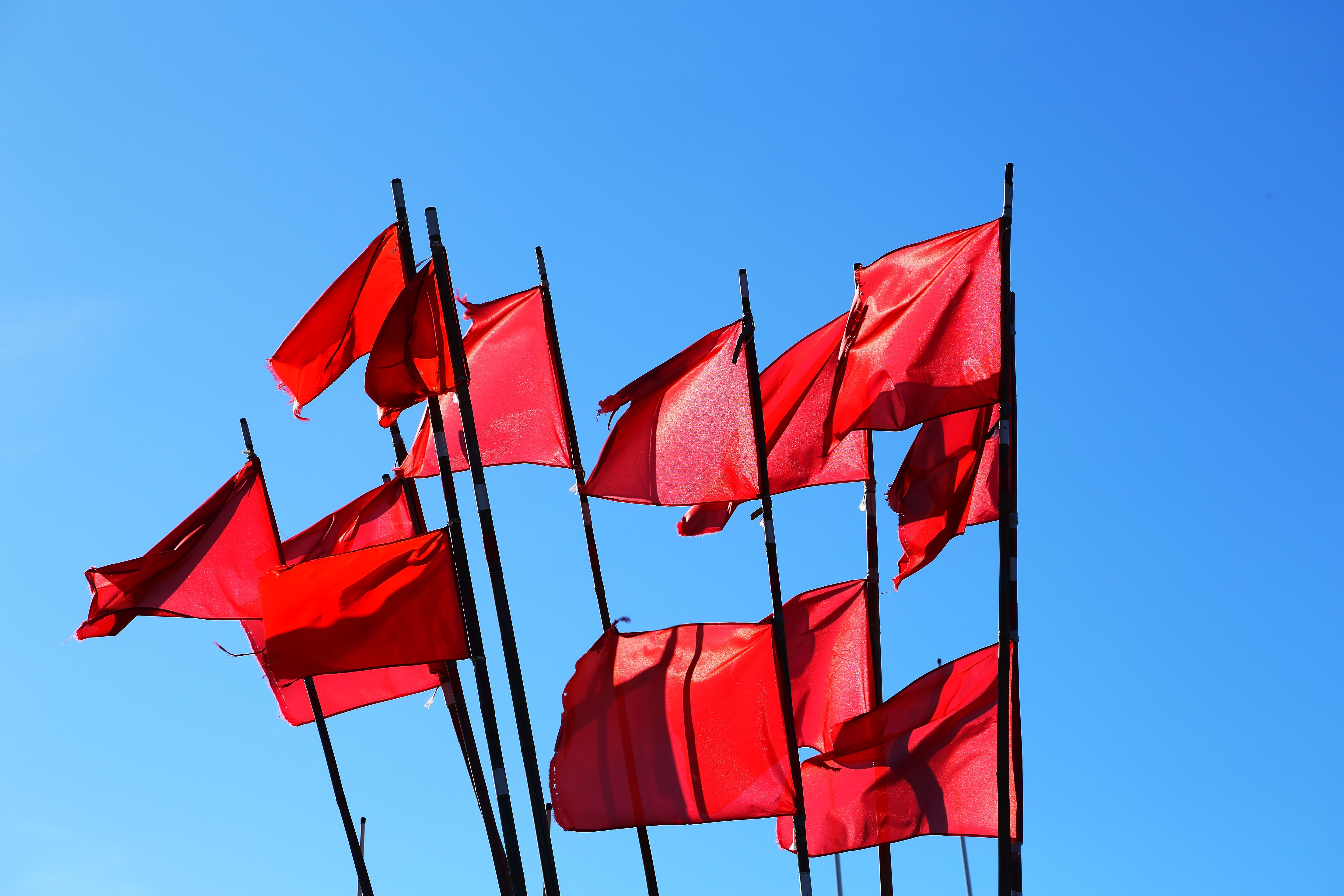 Red flags on blue sky Red flags on blue sky