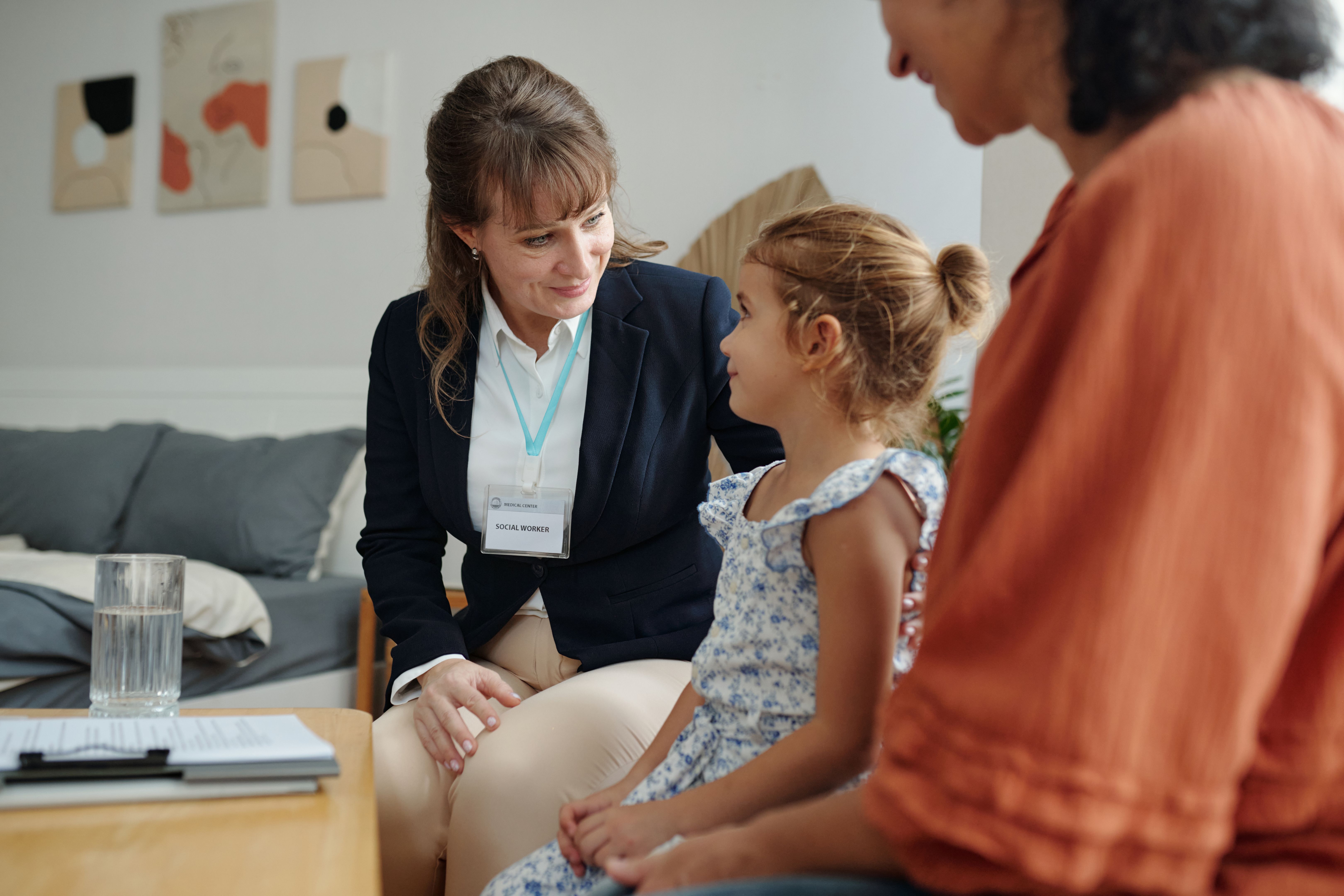 Social Worker Visiting To Family At Home