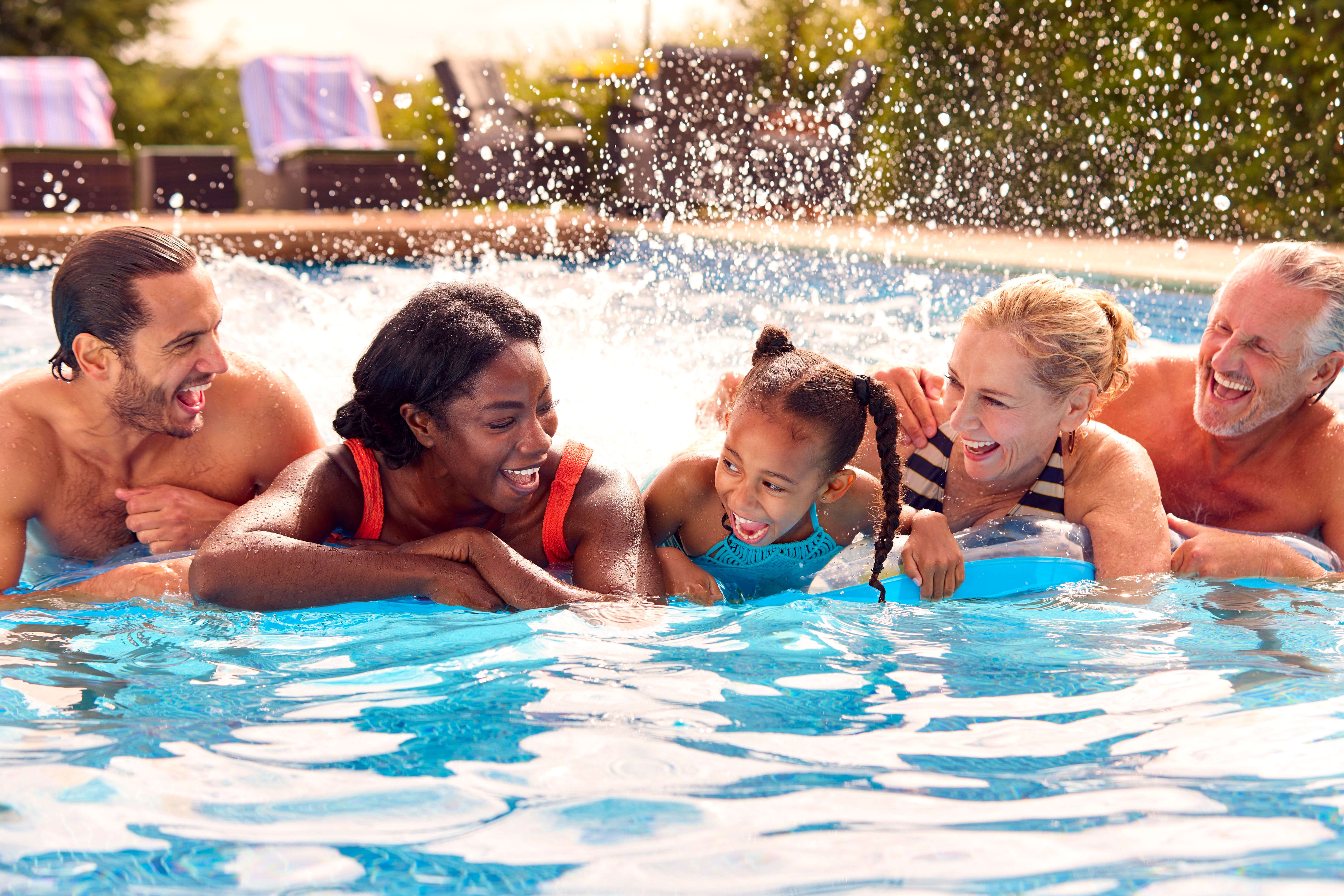 family enjoying pool