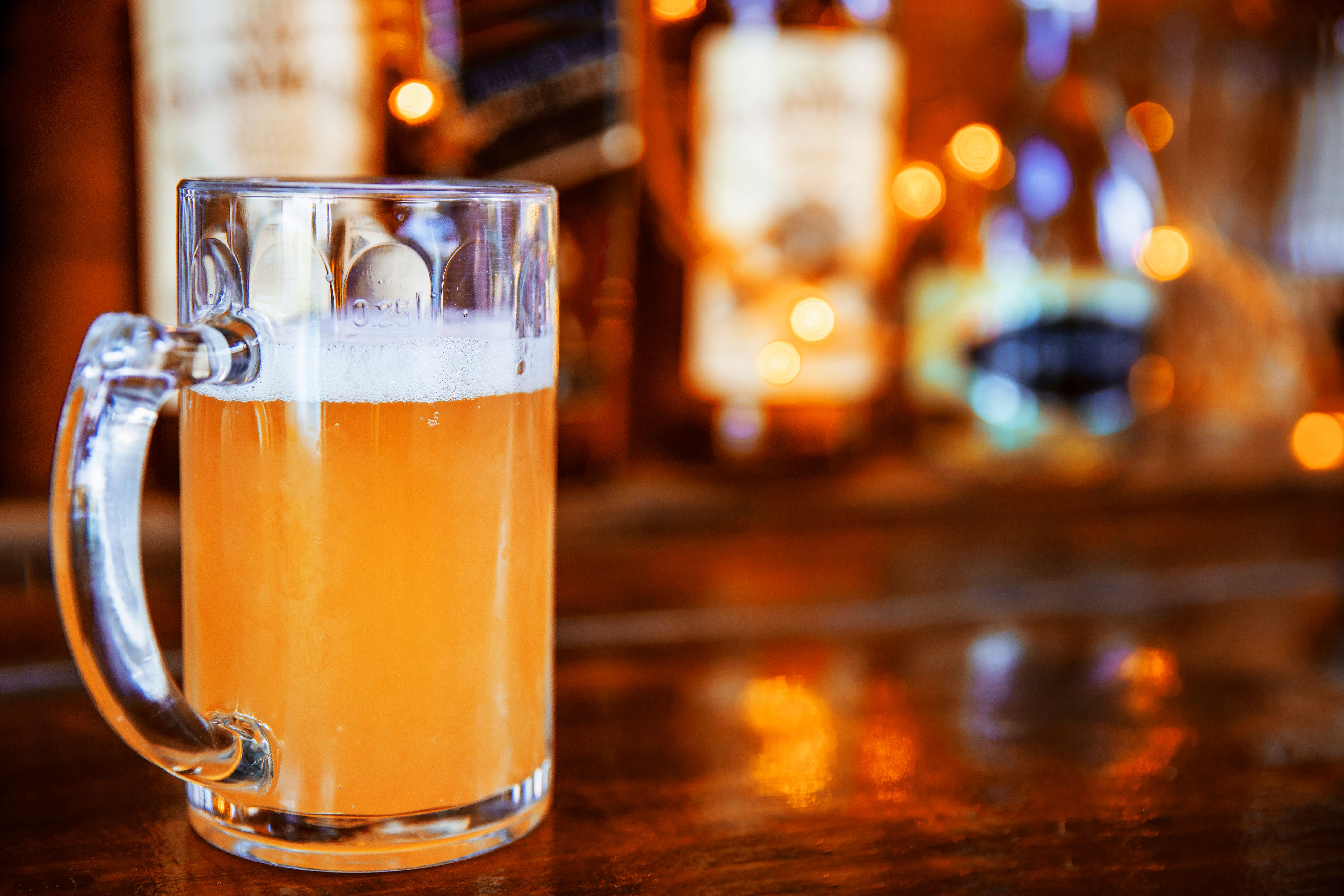 Pint of light beer in bar counter