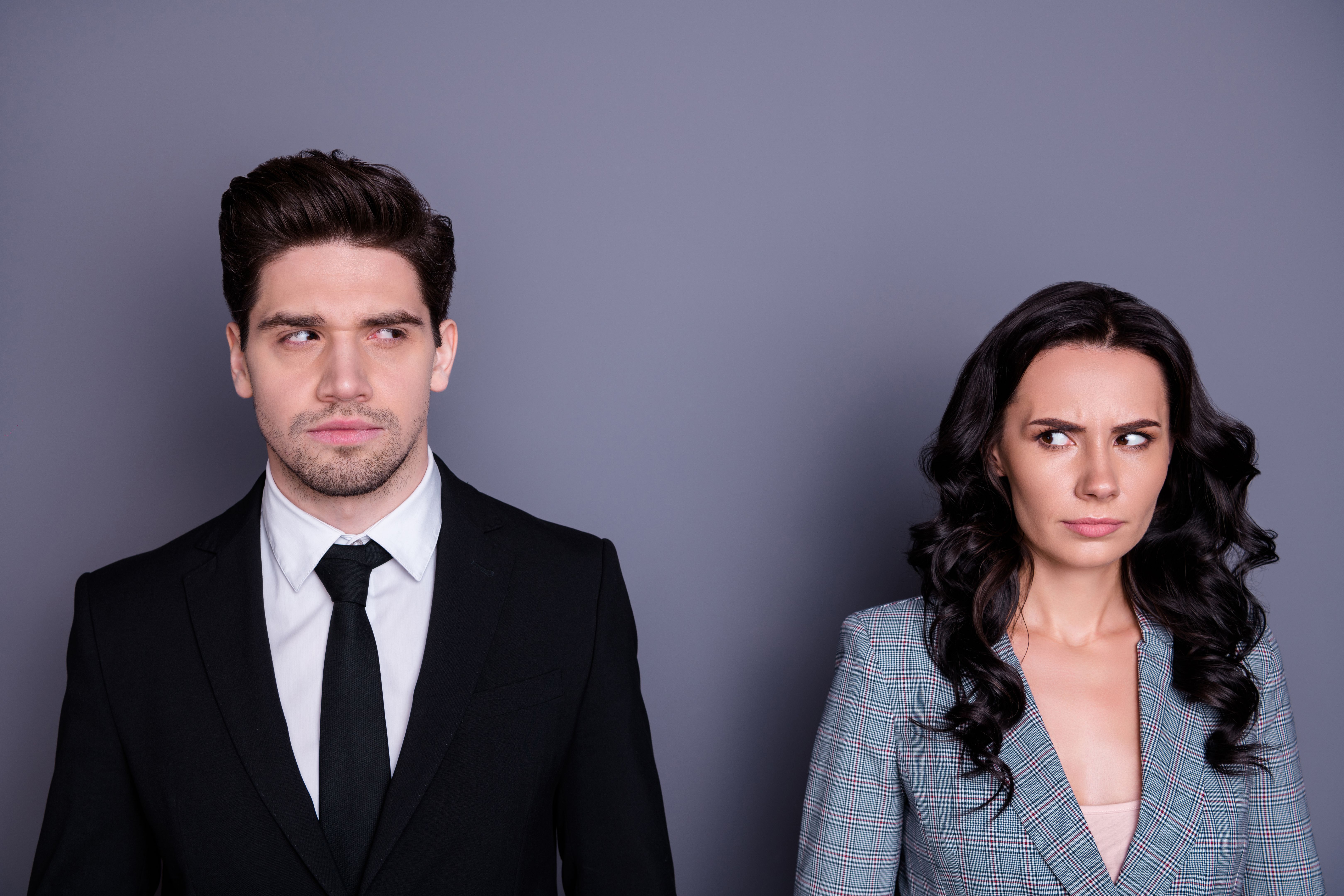 Close-up portrait of his he her she nice attractive stylish doubtful offended leaders partners finance experts lawyers attorney looking at each other isolated over gray violet purple background